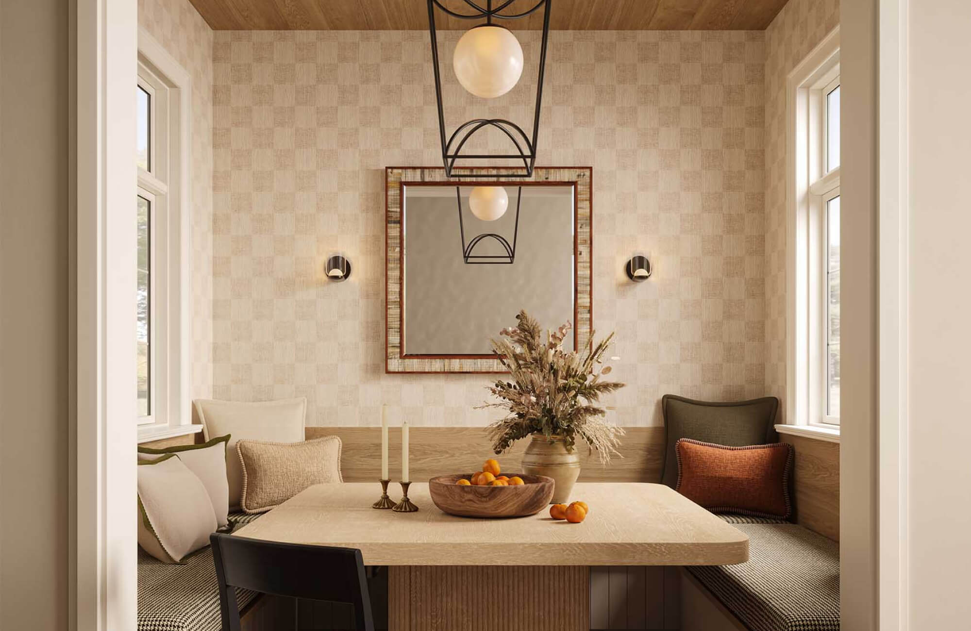 Breakfast nook with warm off-white and fine brown checkered wallpaper, built-in bench seating, wood ceiling, black pendant light, and a dining table with warm neutral decor.