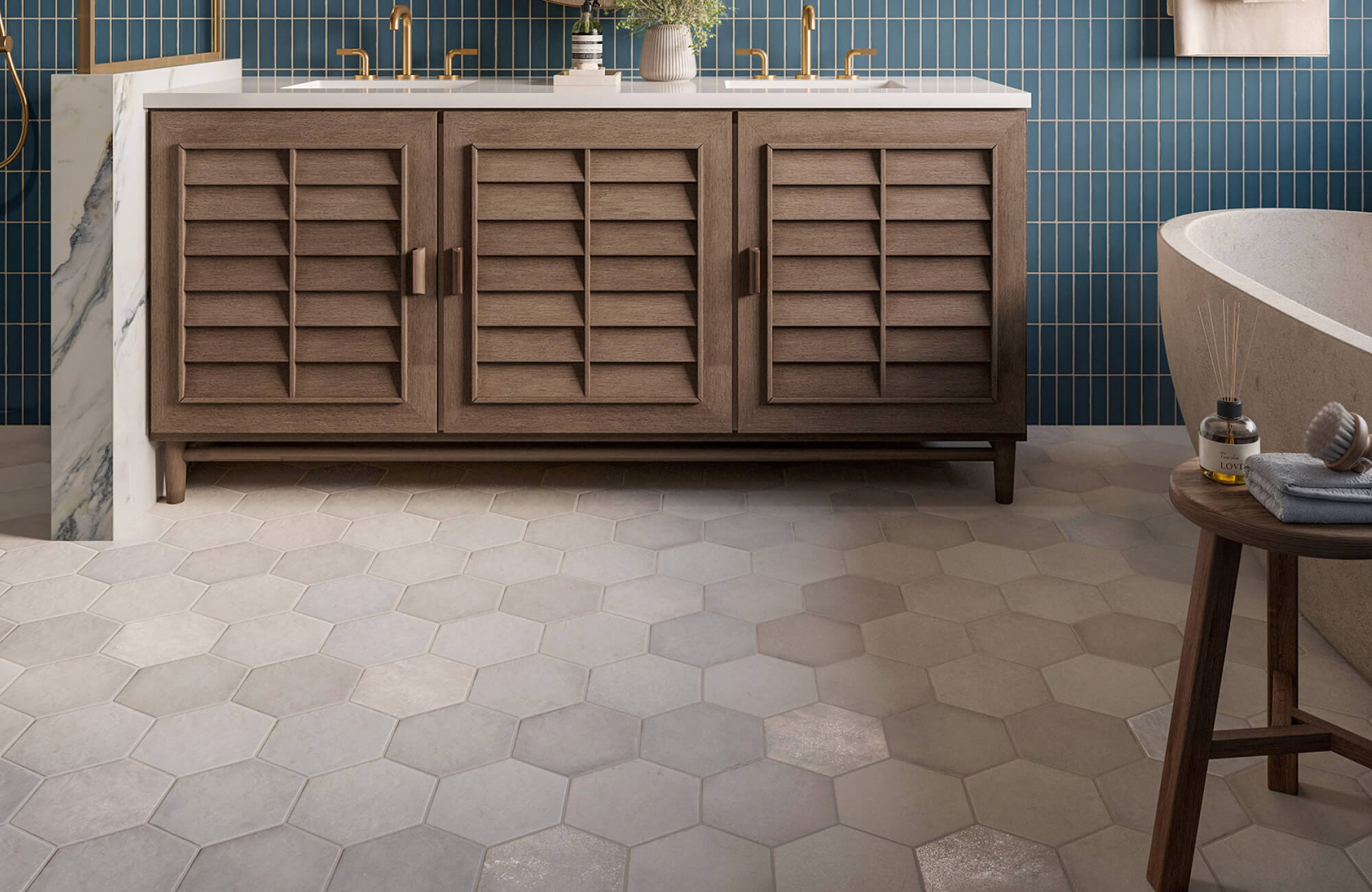 Warm-toned hexagon floor tiles in matte finish create a soft, modern base for this elegant bathroom space.