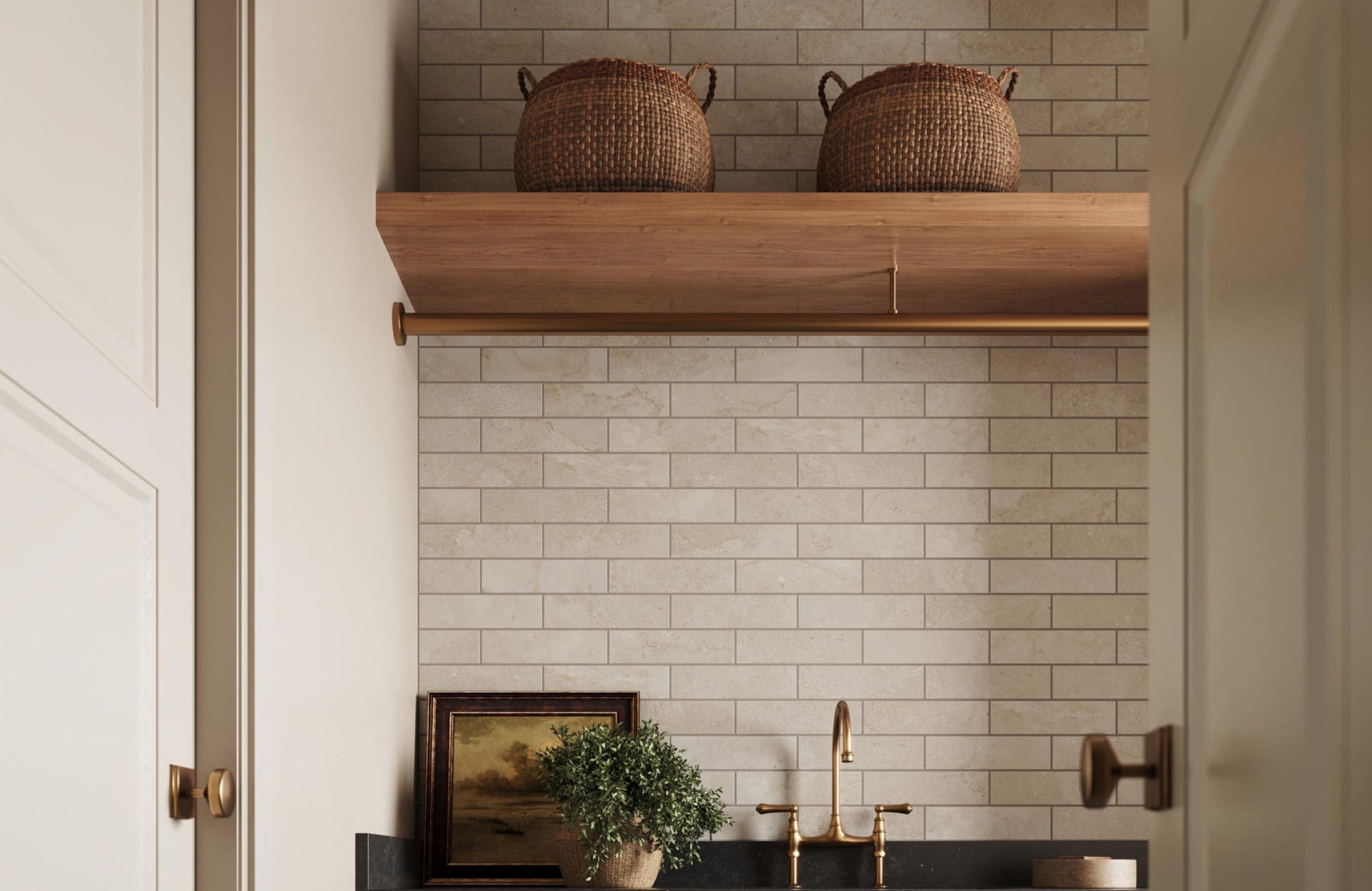 Neutral subway ceramic tile backsplash in a laundry space with woven baskets and wood shelving above a sink.