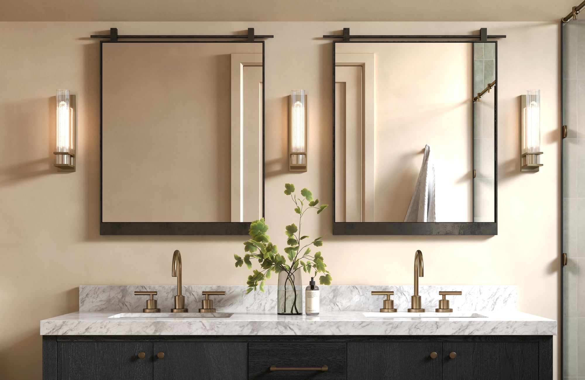 Double bathroom vanity with two rectangular mirrors and warm brass fixtures.
