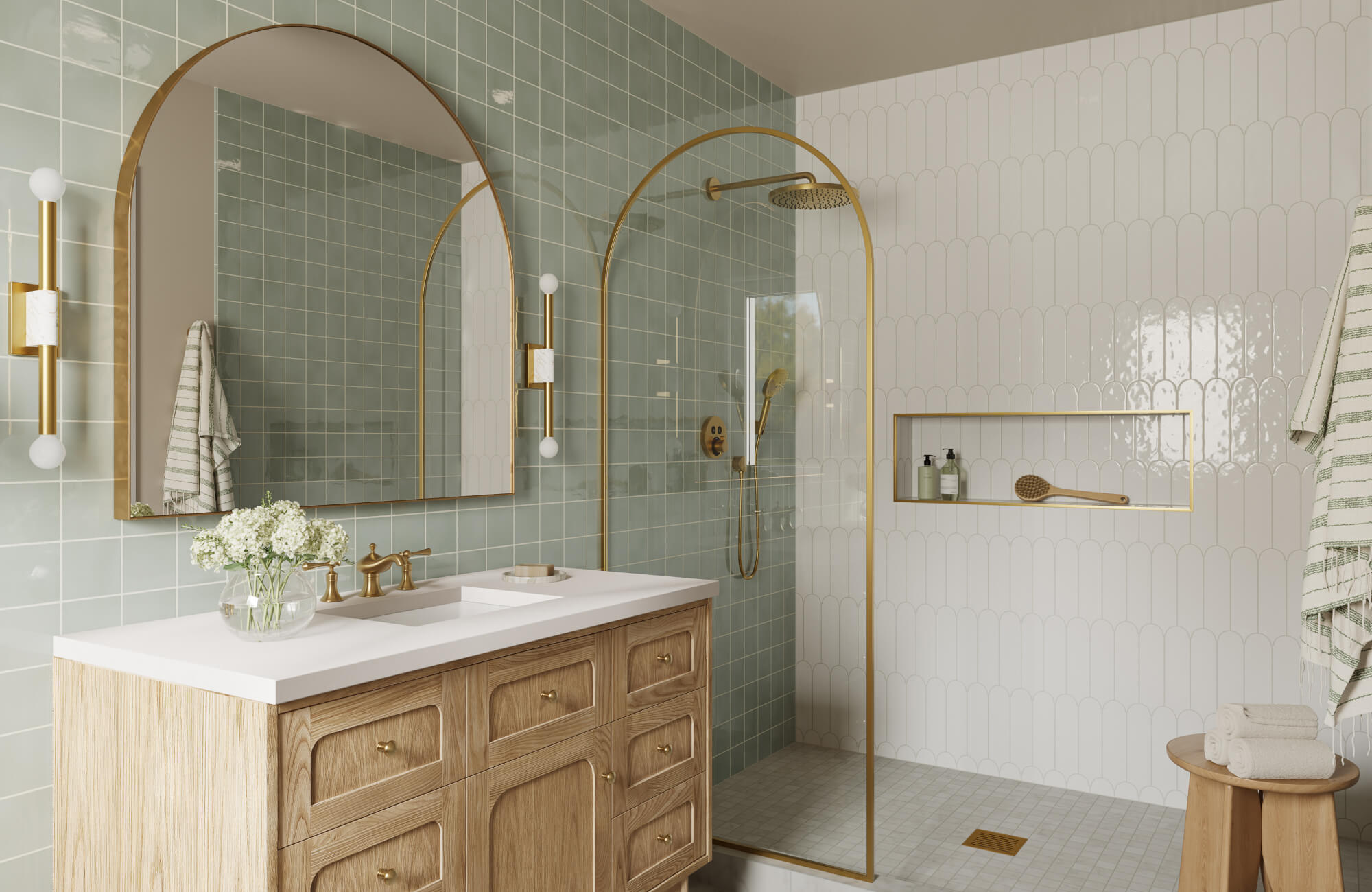 Bathroom with green square wall tiles, white scalloped shower tiles, and gold-framed fixtures around a wooden vanity.