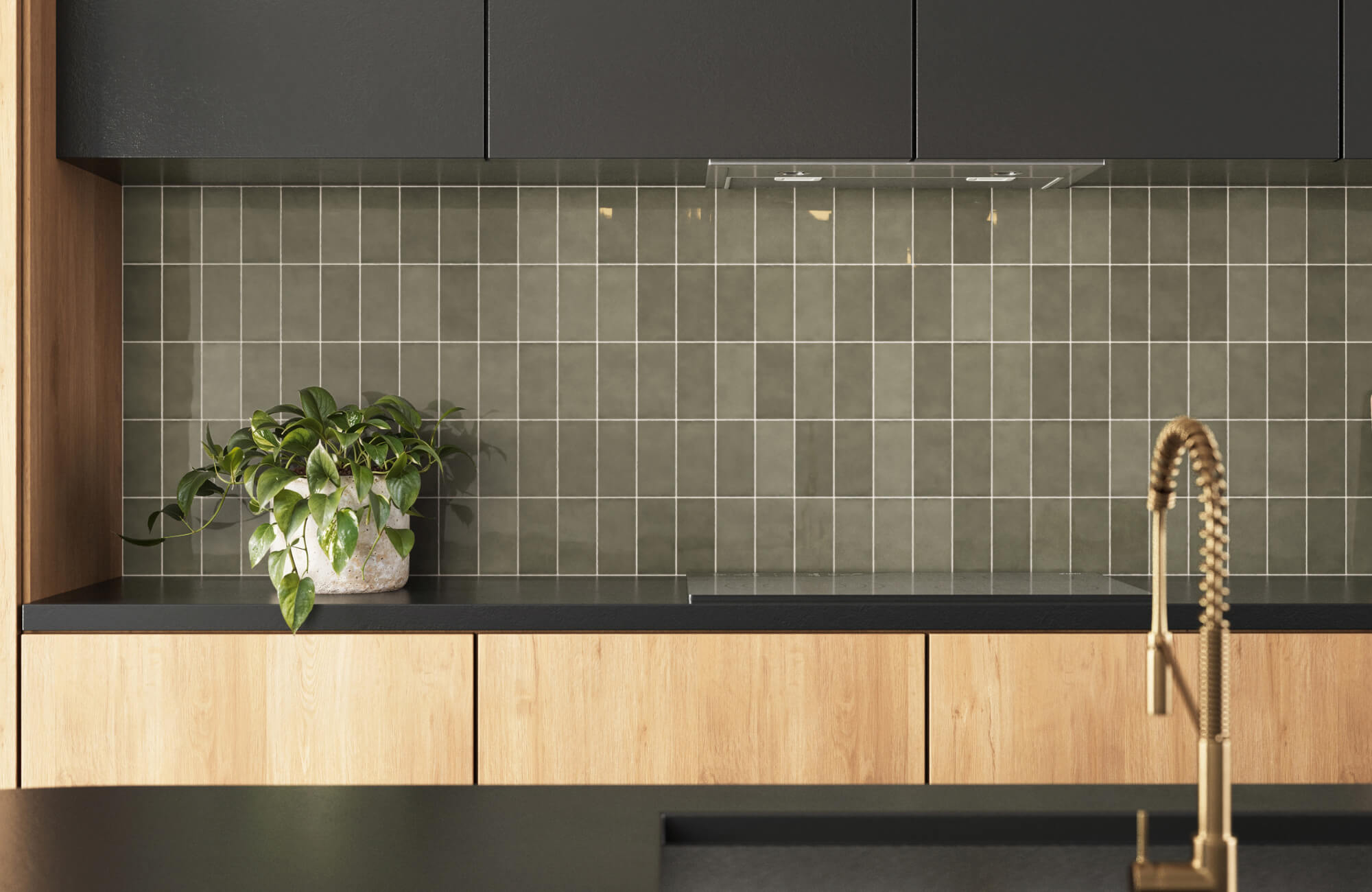 Modern kitchen backsplash featuring glossy olive green square tiles with light grout, black countertops, and natural wood cabinetry.