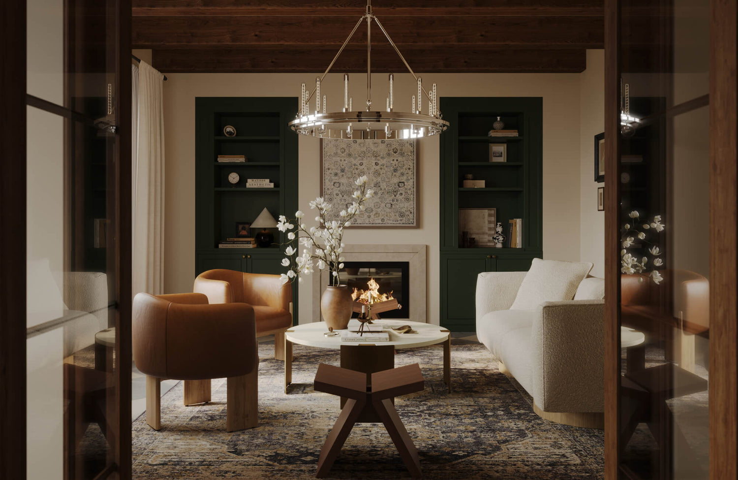 Inviting living room with green built-ins, large area rug, and framed wall art above a cozy fireplace.