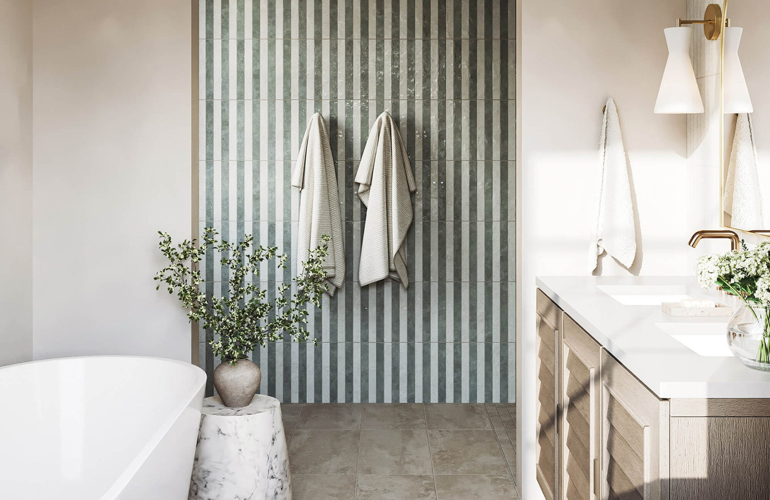 Serene bathroom with vertical striped tile accent wall, freestanding tub, soft greenery, and warm natural light.