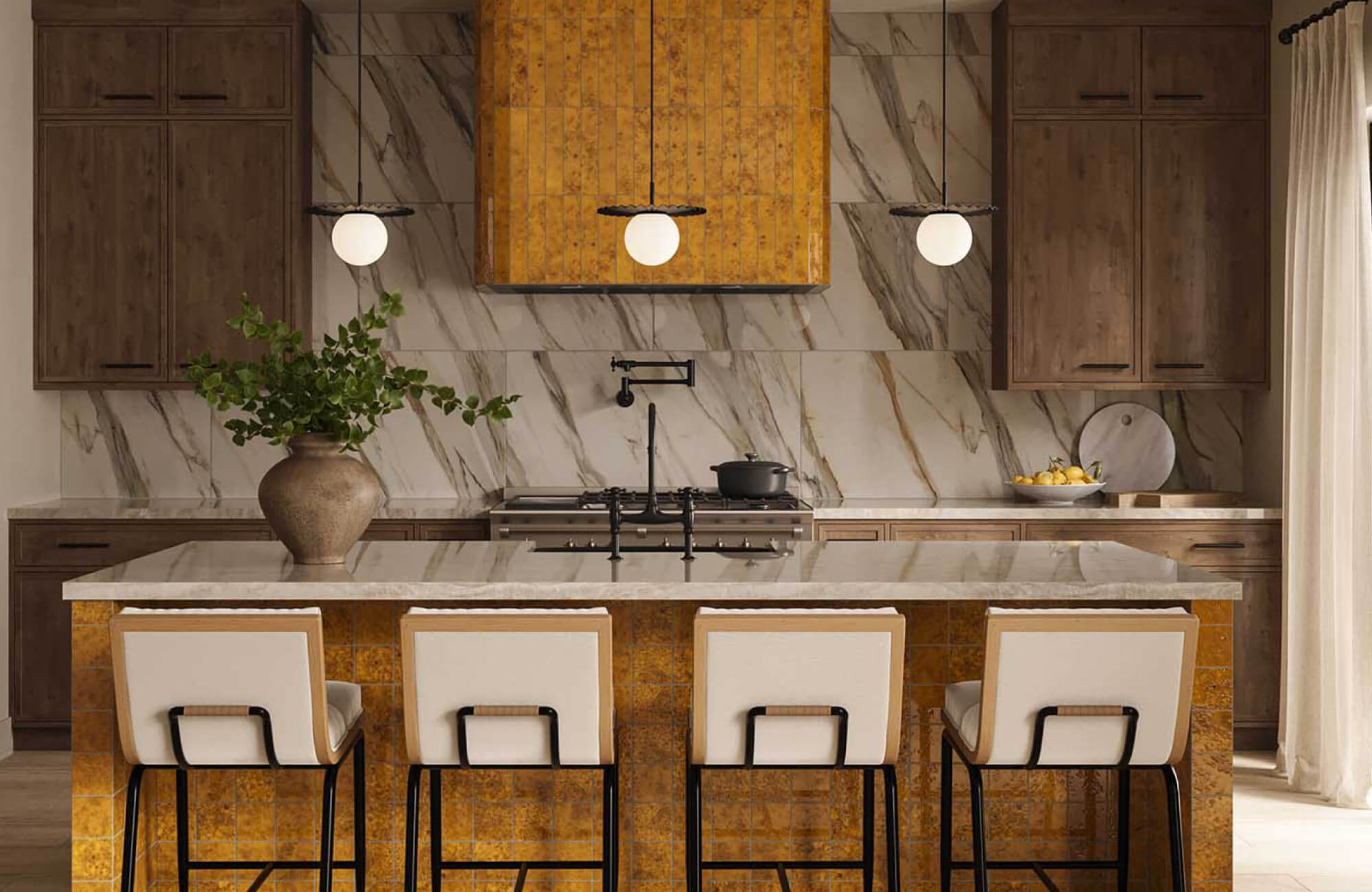 Contemporary luxury kitchen with dramatic marble look tile backsplash, warm wood cabinetry, mustard-toned tiled range hood and island base, waterfall marble island countertop, upholstered bar stools, globe pendant lights, and matte black kitchen fixtures.