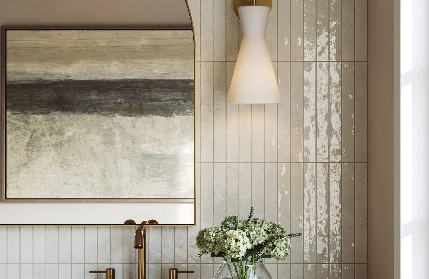 Bathroom vanity with vertical subway tile backsplash, brass faucet, round mirror, and soft neutral lighting.