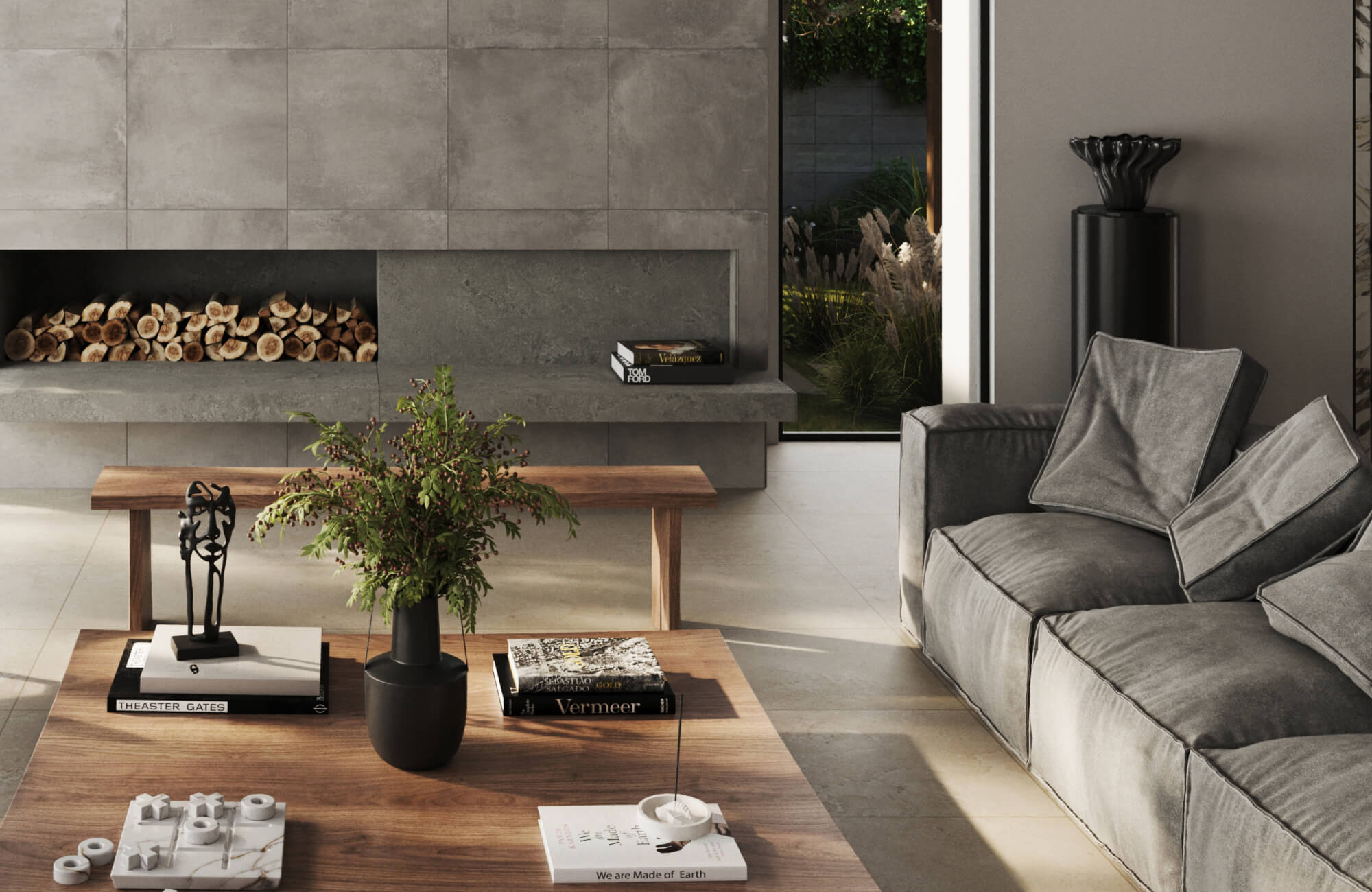 Modern living room with gray sectional sofa and stylish gray throw pillows beside a contemporary concrete fireplace and wooden coffee table.