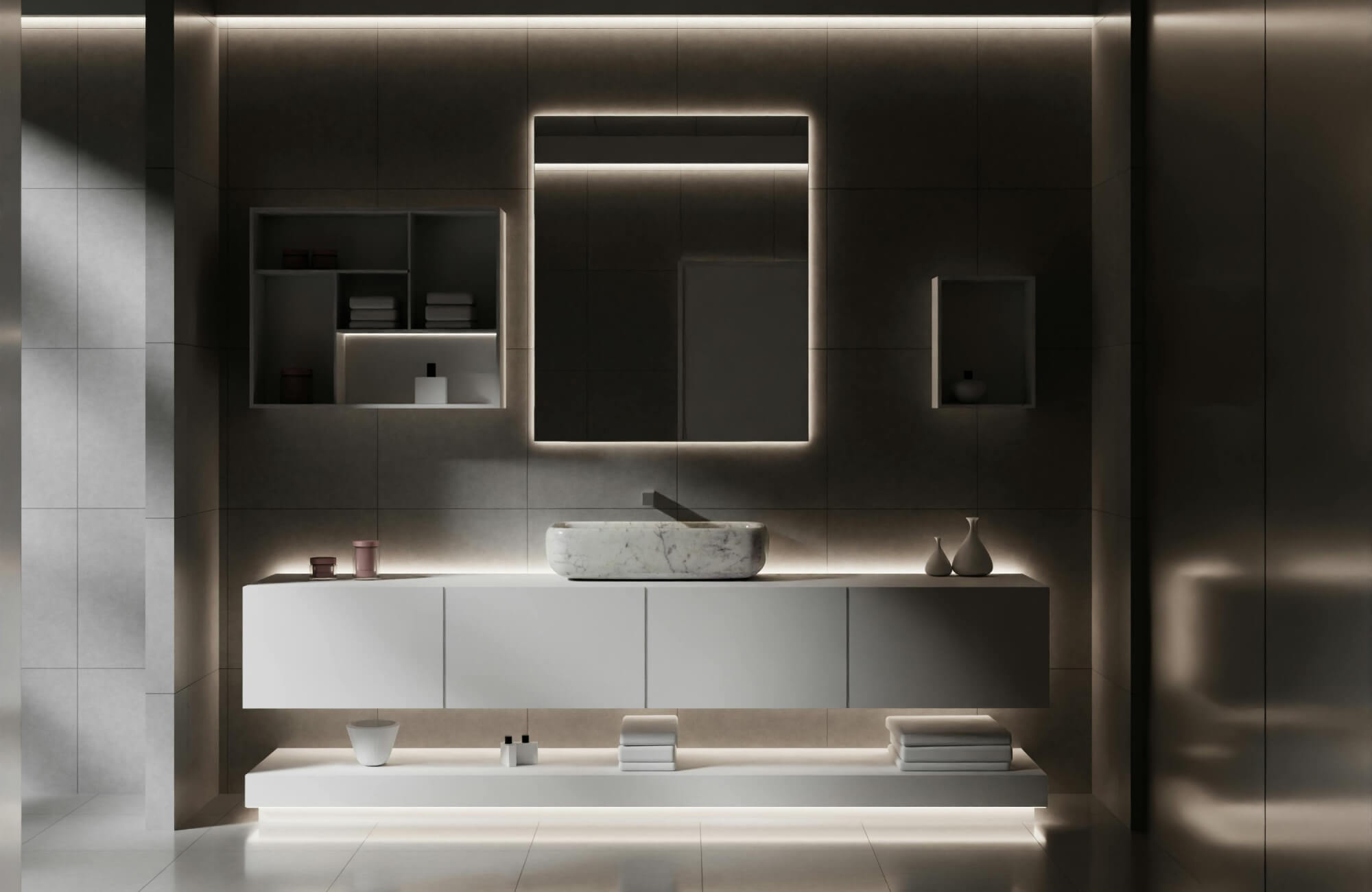 Modern vanity for bathroom with a floating white cabinet, backlit mirror, and sleek marble vessel sink, enhanced by ambient LED lighting for a luxurious minimalist look.