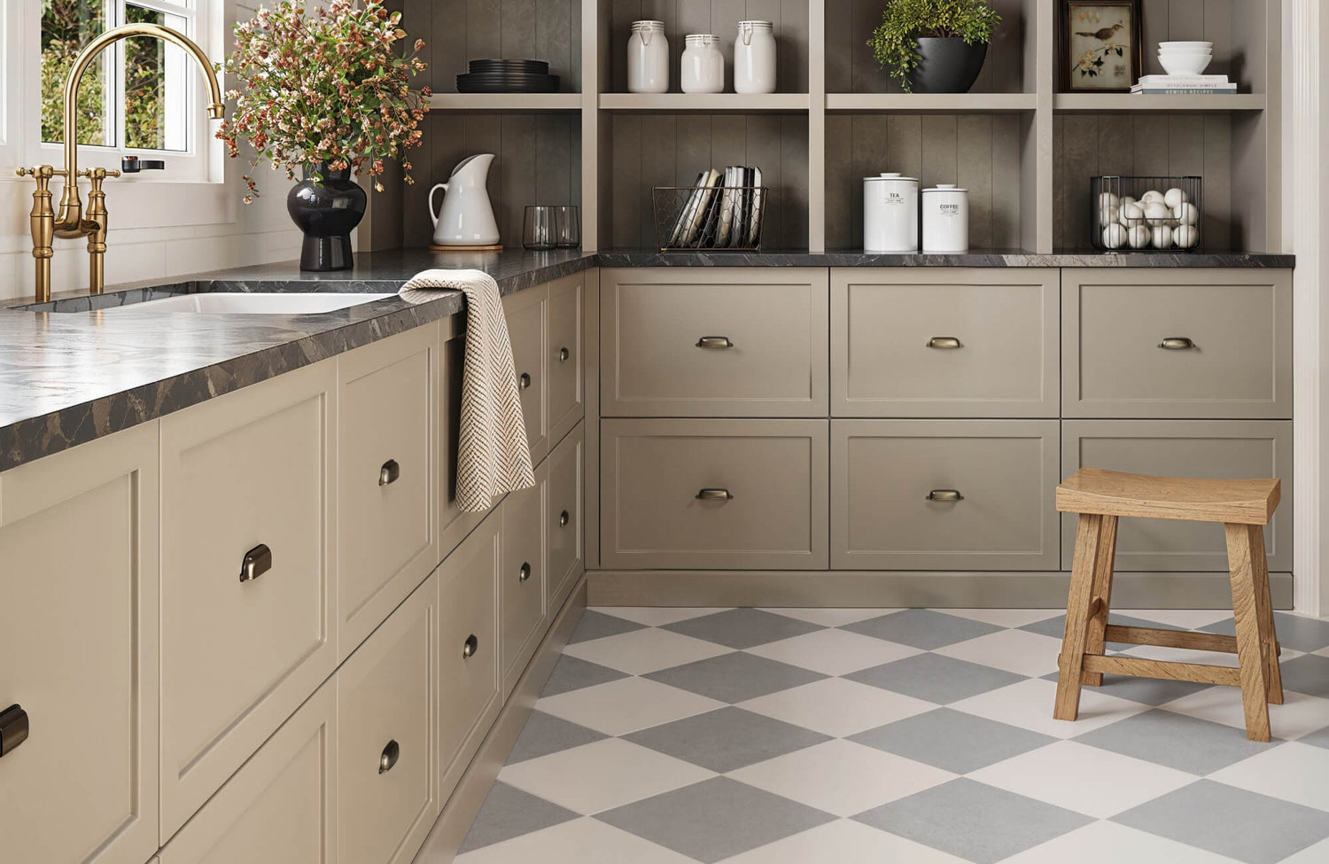 Cozy kitchen with beige cabinetry, a sleek marble countertop, and light grey and white chequered tiles, complemented by rustic wooden accents