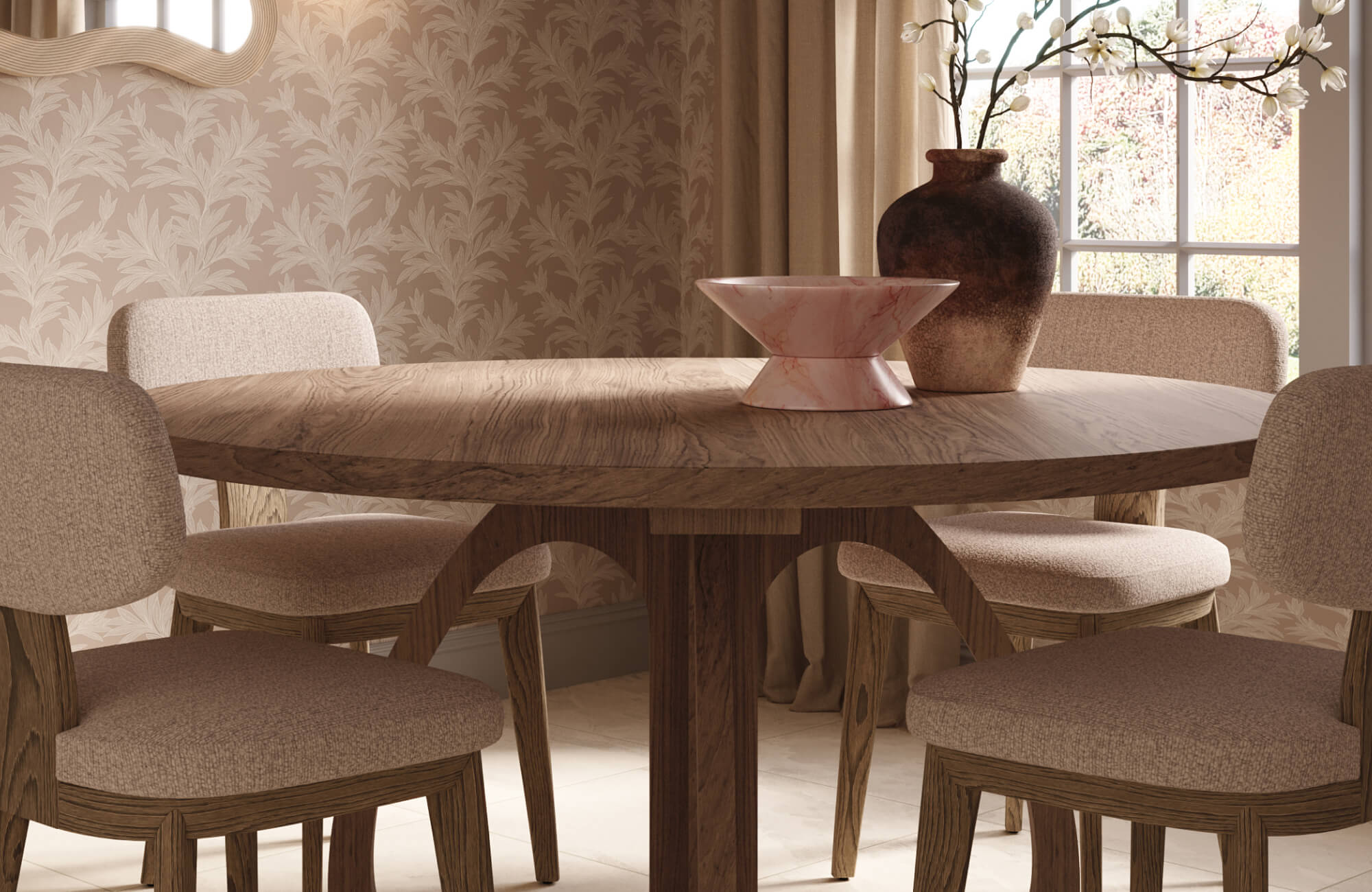 Warm dining nook with a round wood table, upholstered dining chairs, a pink marble decorative bowl, and a rustic ceramic vase styled against soft botanical wallpaper and natural light.