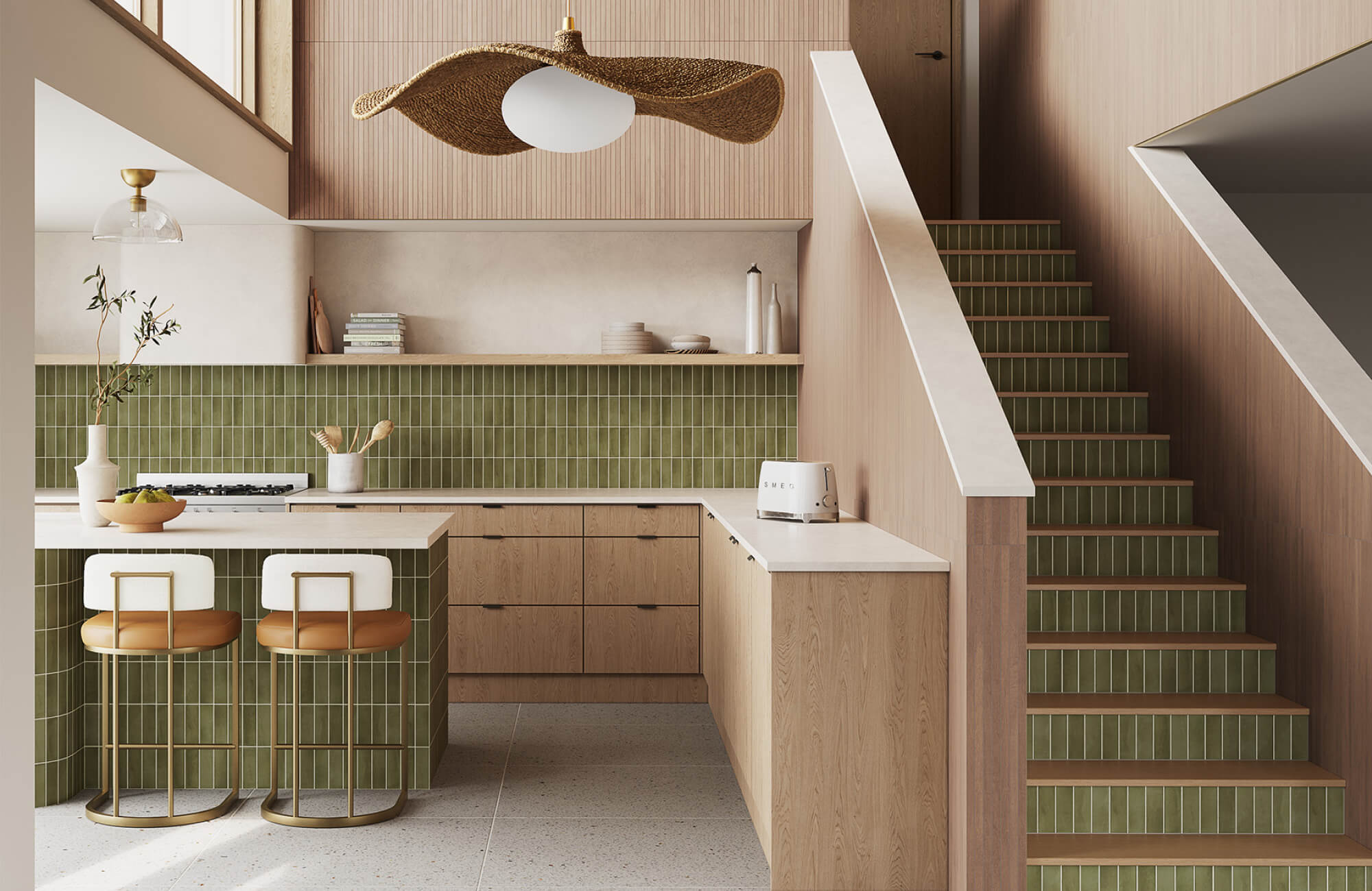 Green vertical subway tile kitchen backsplash and island front, paired with light wood cabinetry, wood stair risers, brass accents, and a bright open layout.