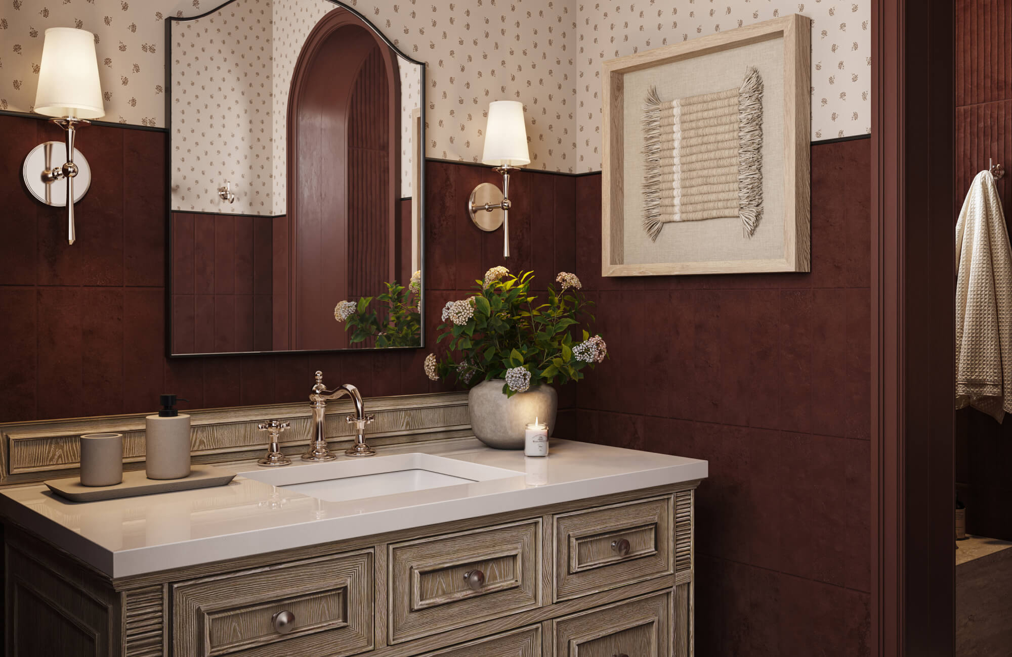 A framed woven wall piece in soft beige tones adds texture above the vanity, gently balancing the rich brown wall panels and echoing the warmth of the wood cabinetry.