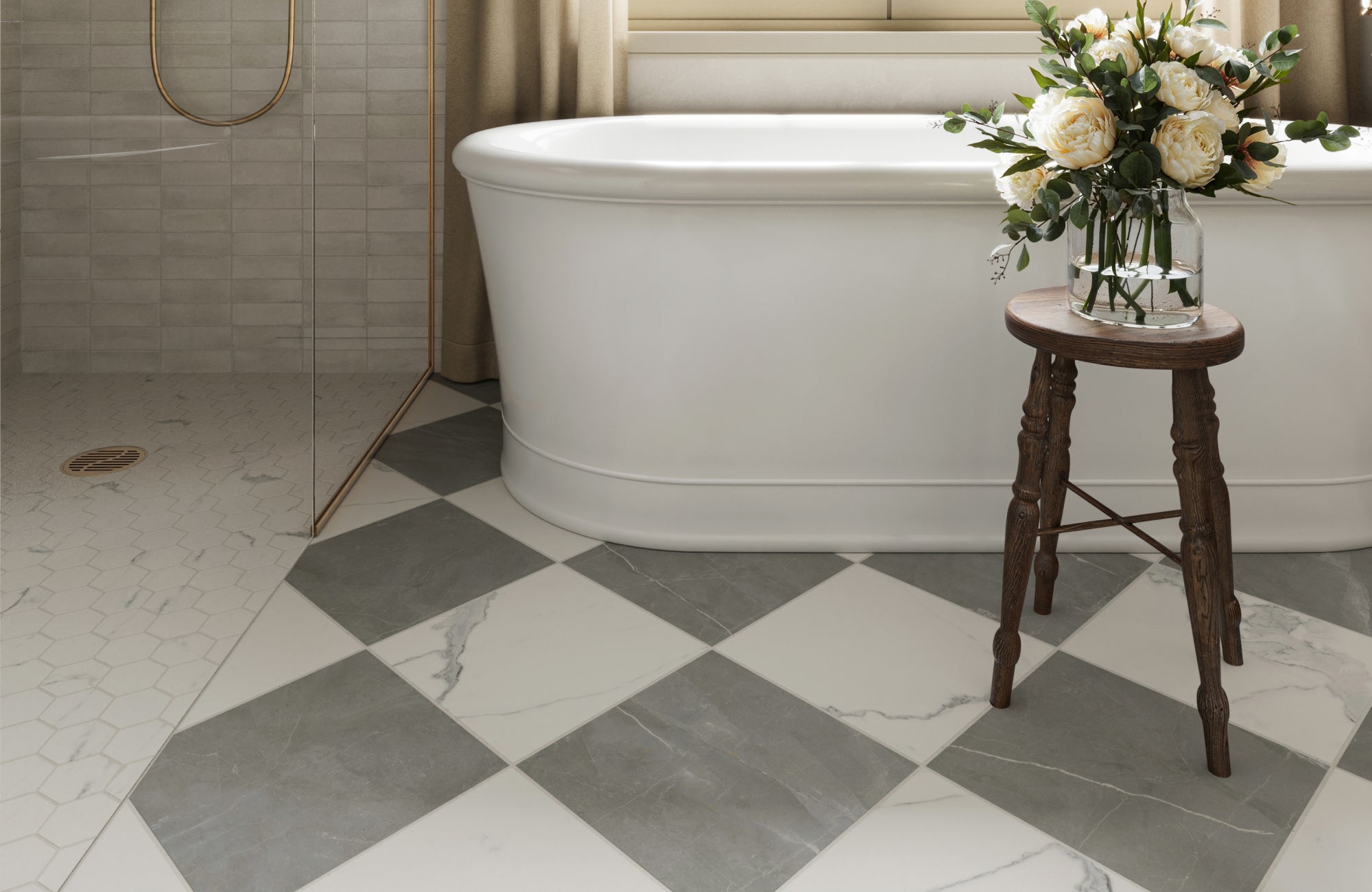Serene bathroom with gray and white checkered tiles, a freestanding tub, and a hexagonal tiled shower accented by brass trim for timeless elegance.