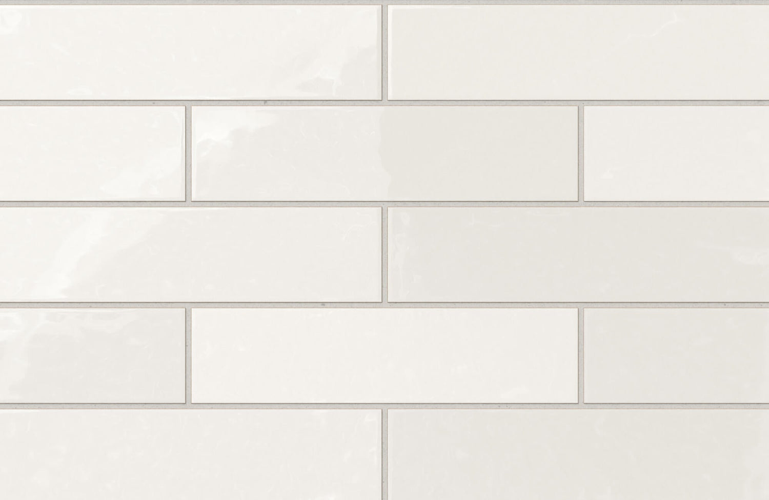 Glossy ceramic off-white subway tiles with subtle tonal variation create a clean, timeless look perfect for modern interiors.