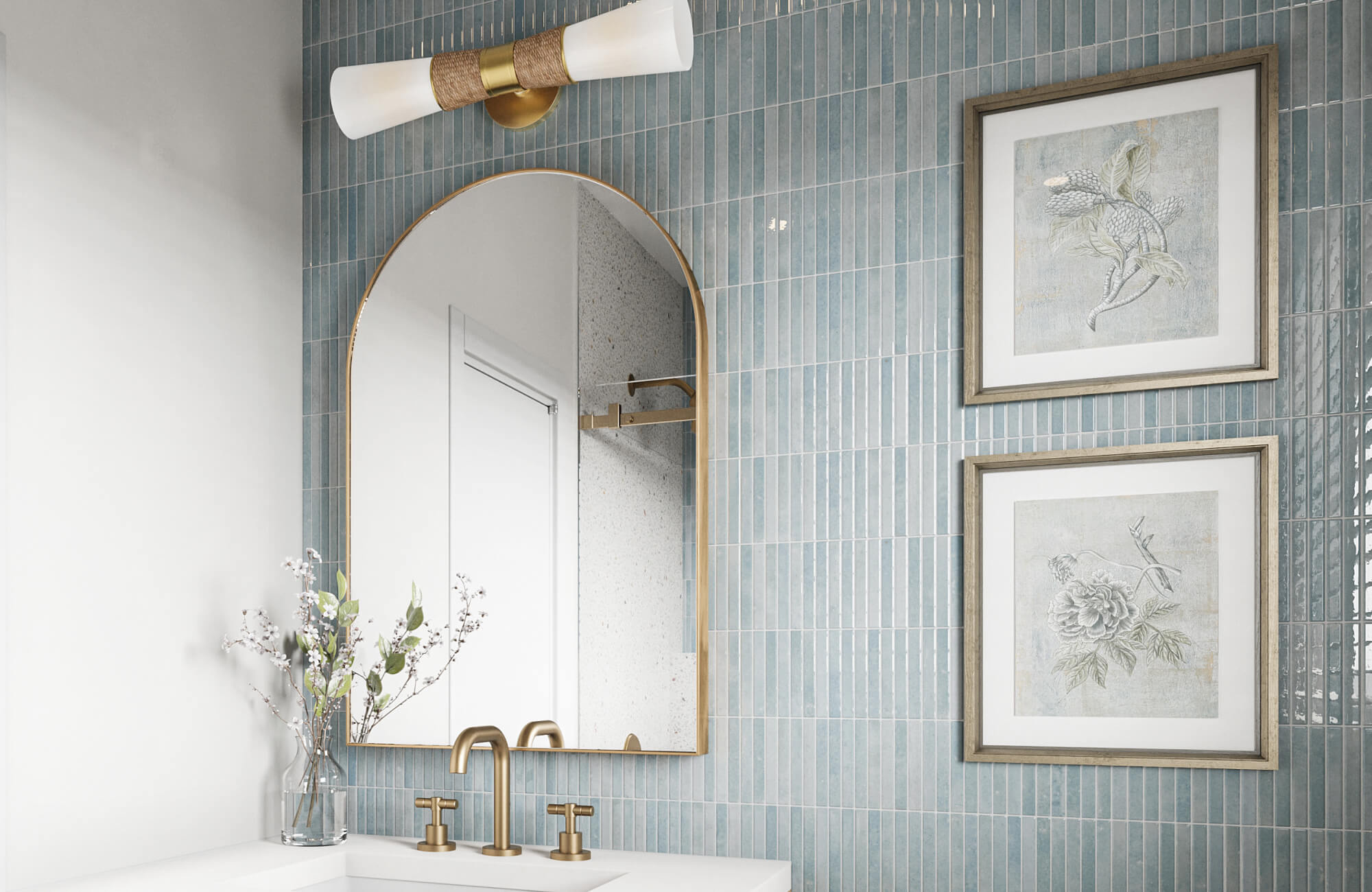 Glossy vertical blue ceramic tiles create a serene backsplash in this modern vanity, paired with brass fixtures and an arched mirror.