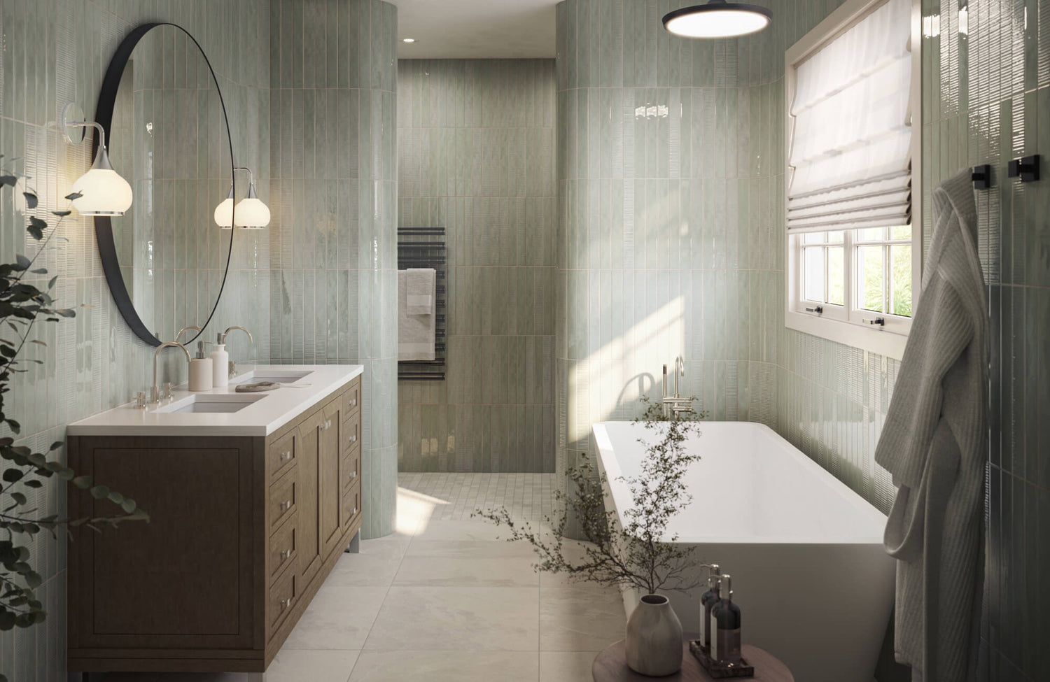 Serene modern bathroom with vertical green subway tile walls, freestanding tub, wood vanity with round mirror, and soft natural light with botanical accents.