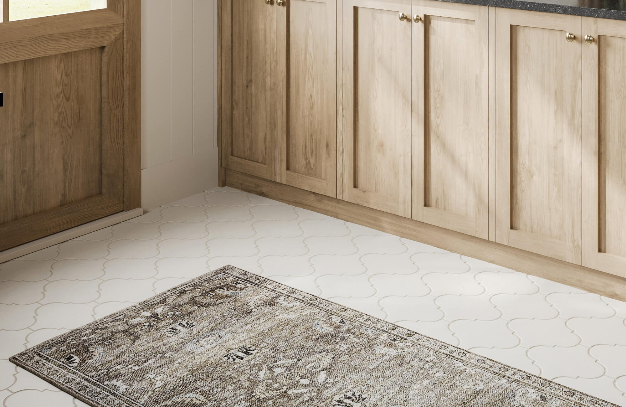 Elegant white arabesque tiles paired with a vintage-style rug, adding charm and warmth to the mudroom entry.