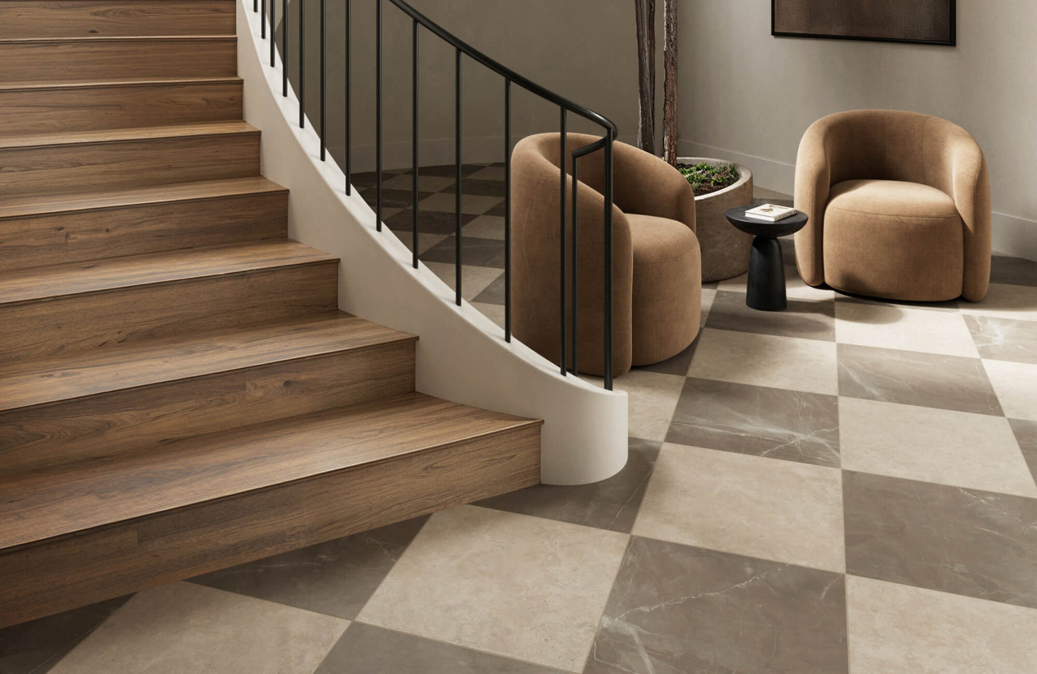 Sophisticated entryway with a taupe and beige checkerboard marble floor, warm wood stairs, and plush modern seating.