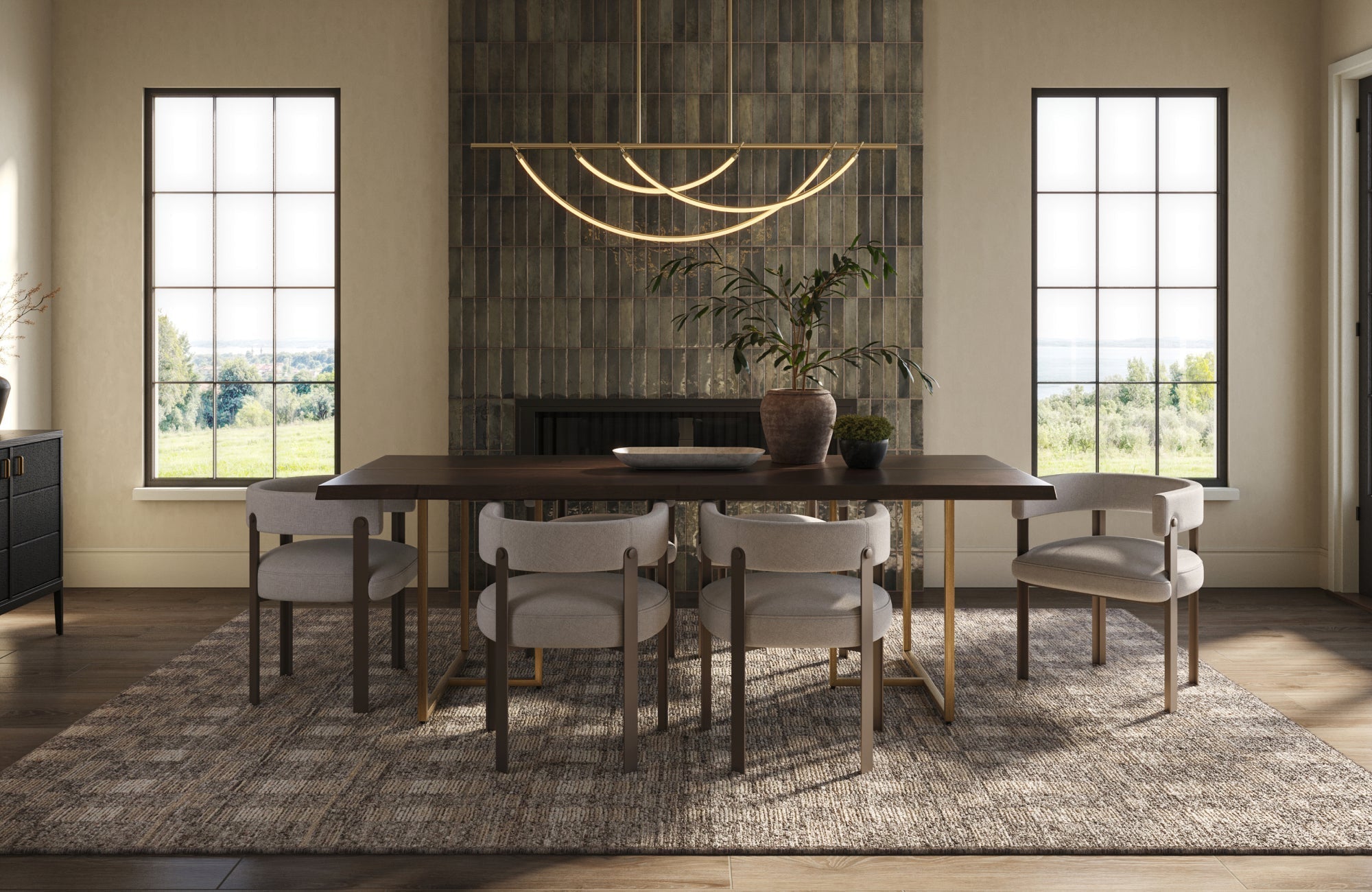 A modern dining space featuring a dark wood table, neutral chairs, a curved gold light fixture, and a textured rug set between two large sunlit windows.
