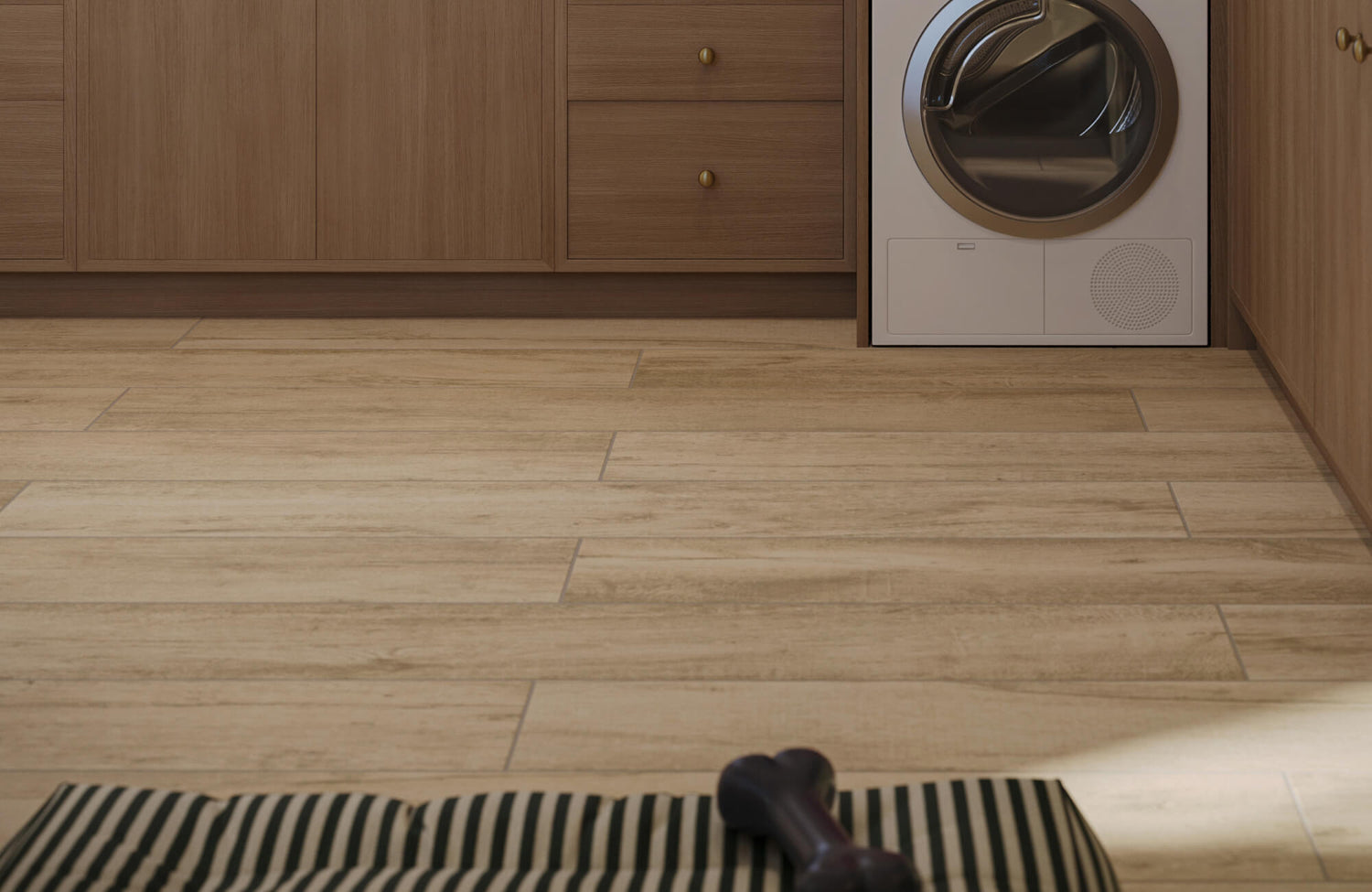 Hardwood-look porcelain tile flooring in a laundry area, showing plank layout and natural wood grain texture
