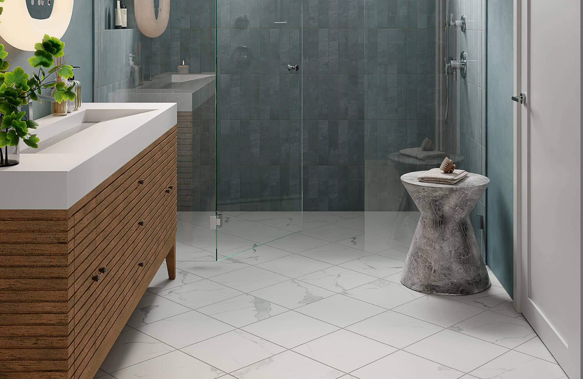 Modern bathroom with white marble-look floor tiles featuring soft gray veining, creating a clean and polished foundation beneath a wood vanity and blue tiled shower.
