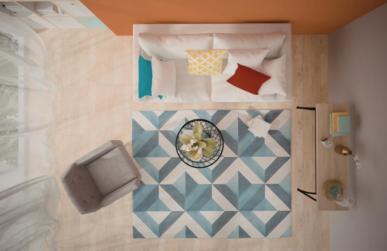 Top-down view of a neutral living room anchored by a blue geometric rug, with a sofa, accent chair, and coffee table arranged symmetrically.