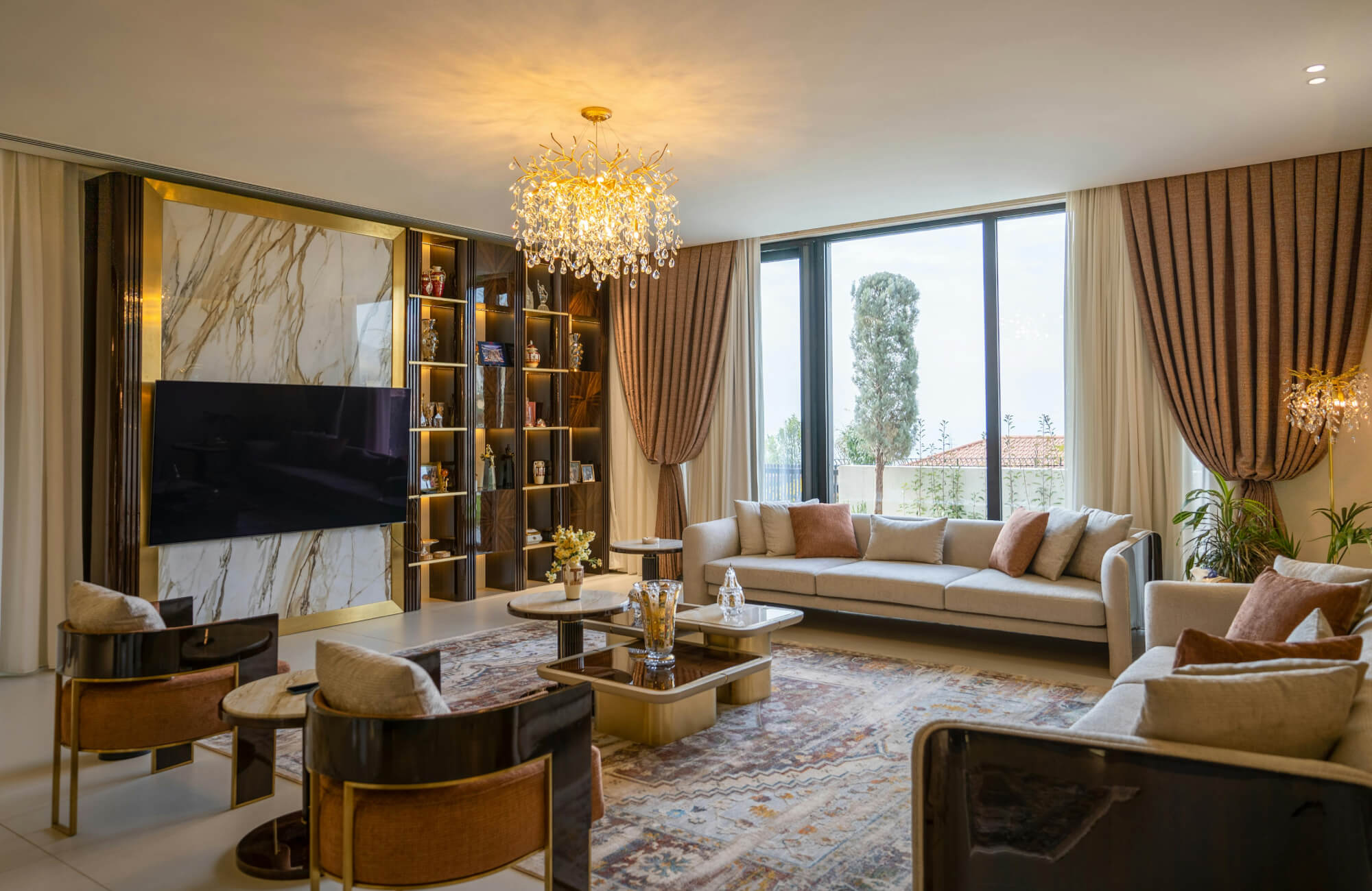 Elegant crystal chandelier brightening a modern living room with warm light and balanced energy flow.