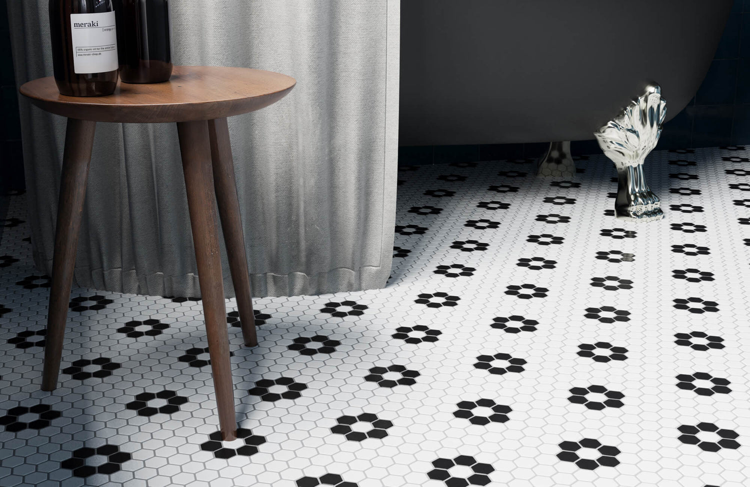 Black and white hexagon mosaic bathroom floor tile with clawfoot tub and patterned vintage design.