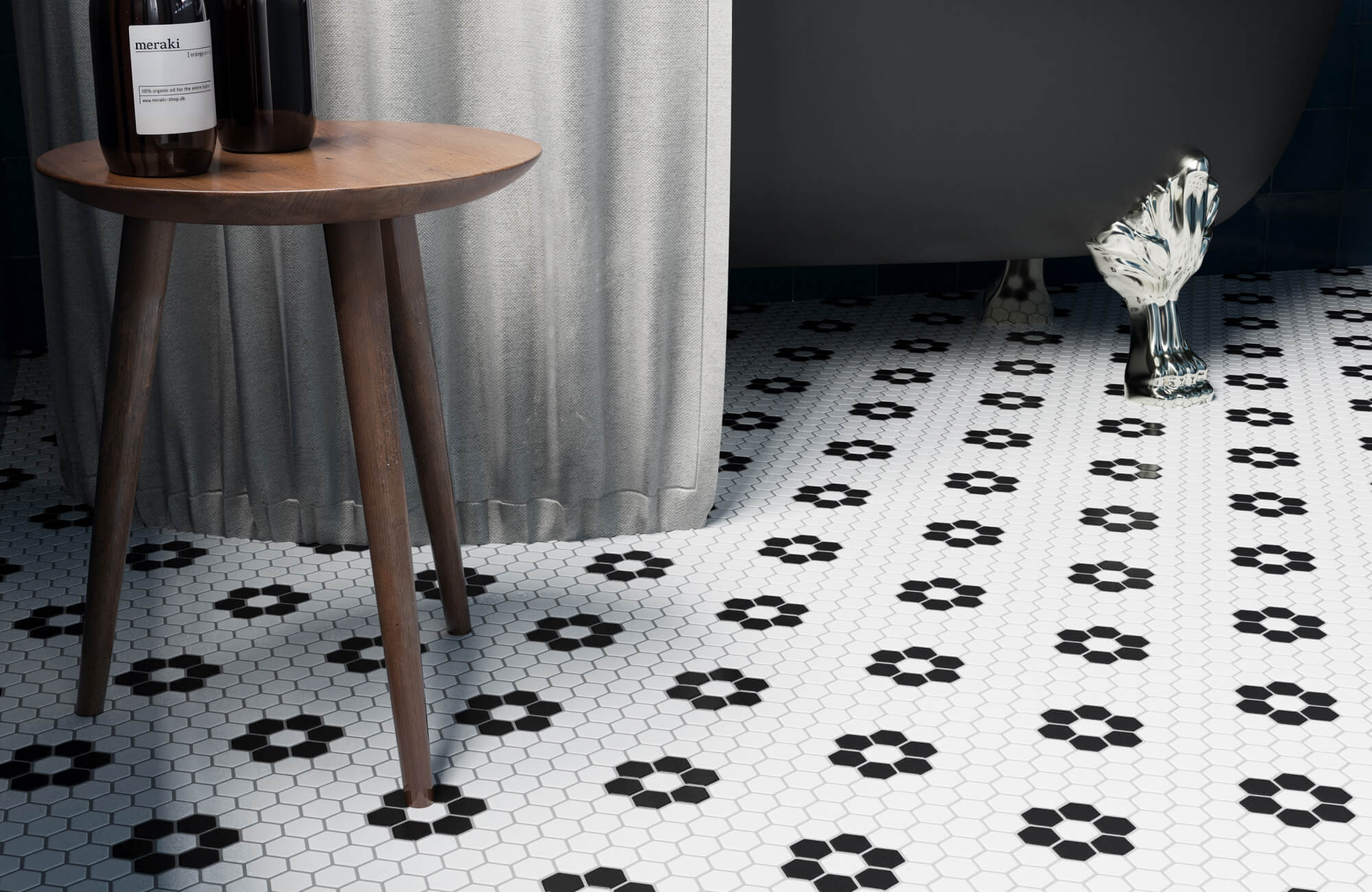 Black and white hexagon mosaic bathroom floor tile with clawfoot tub and patterned vintage design.
