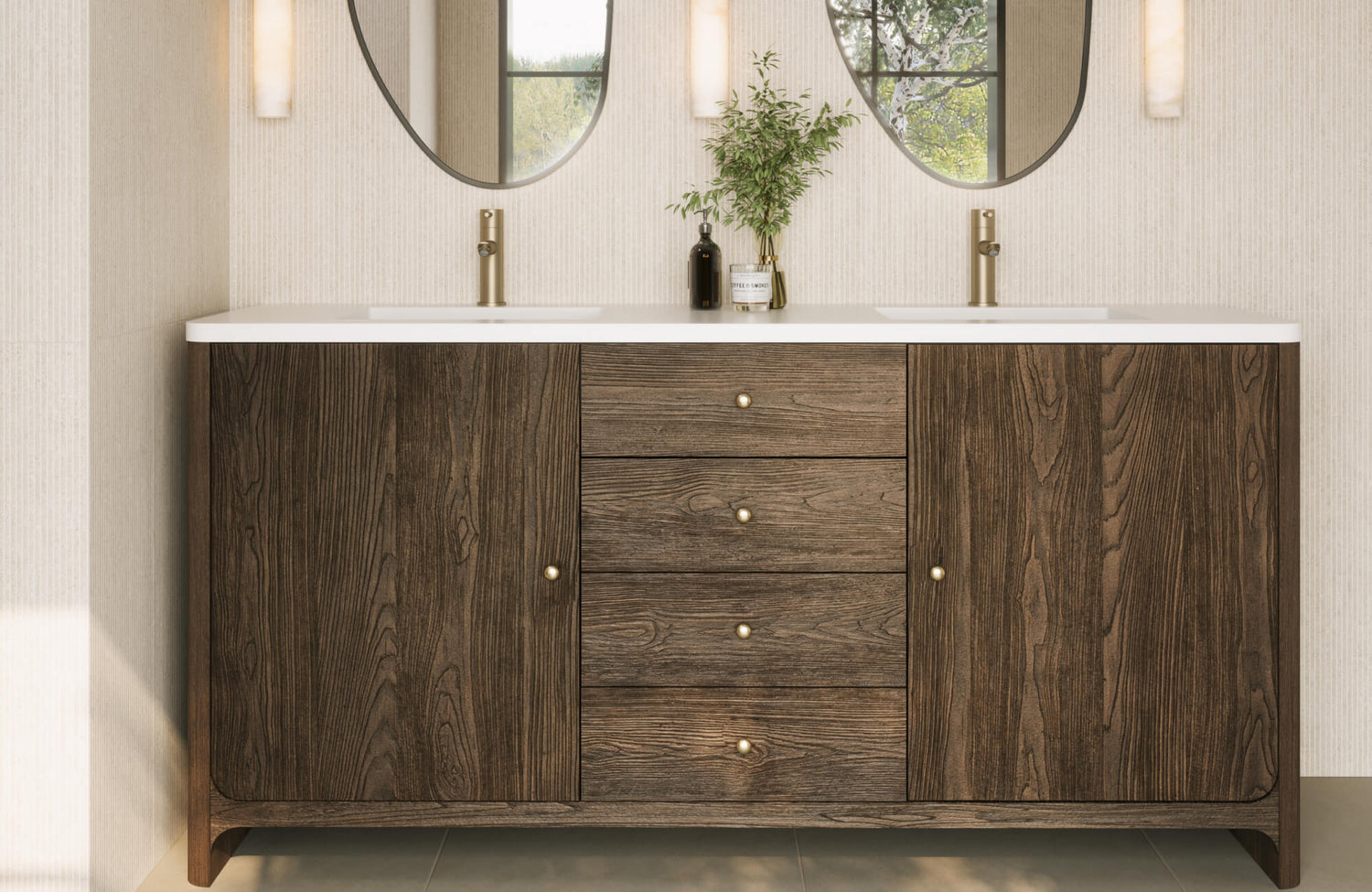 Modern bathroom vanity with dark wood finish, four central drawers, white countertop with dual sinks, brass faucets, and oval mirrors above