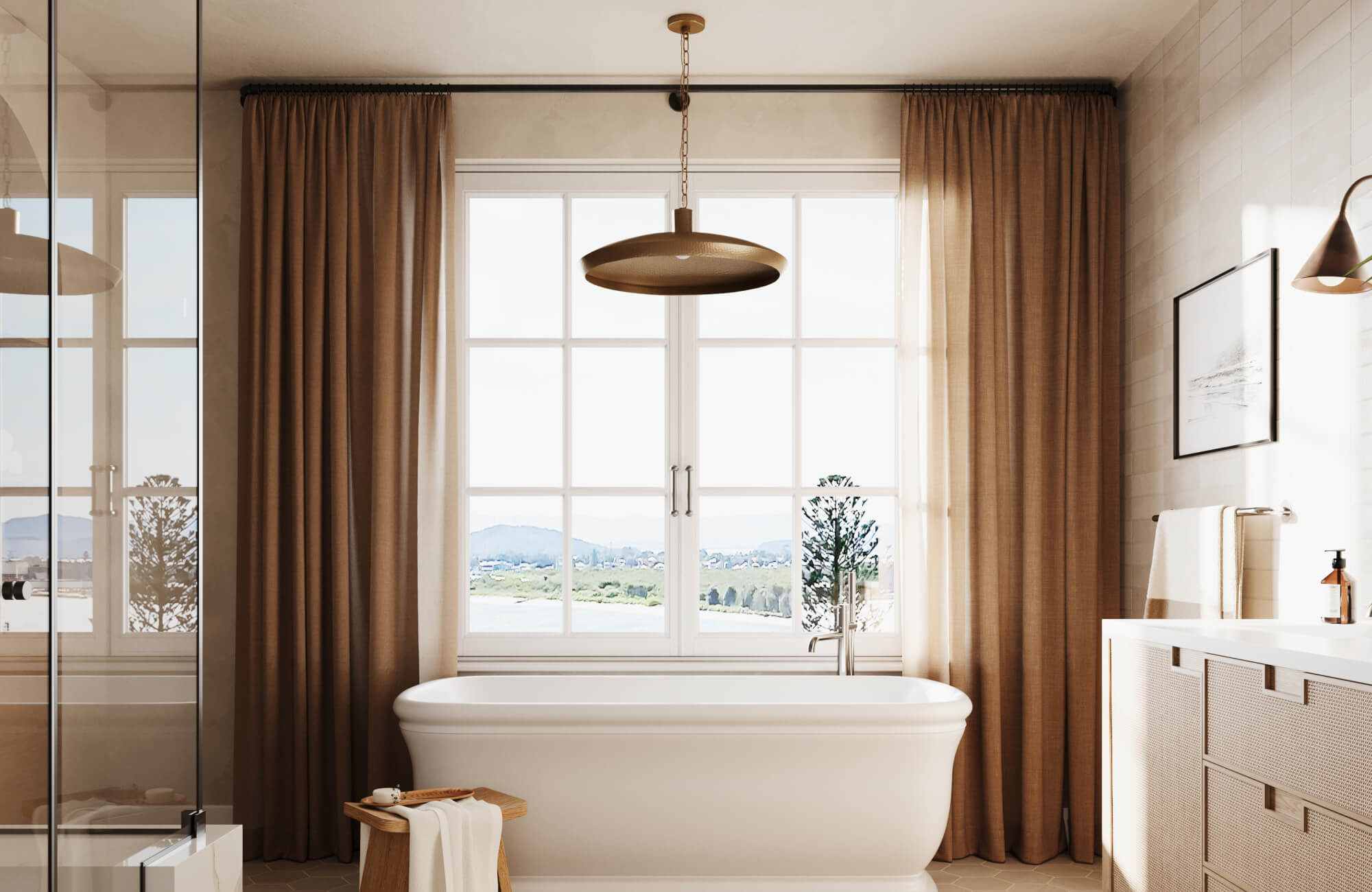 Freestanding white bathtub with bronze pendant and wall lights, set against beige curtains and soft neutral wall tiles.