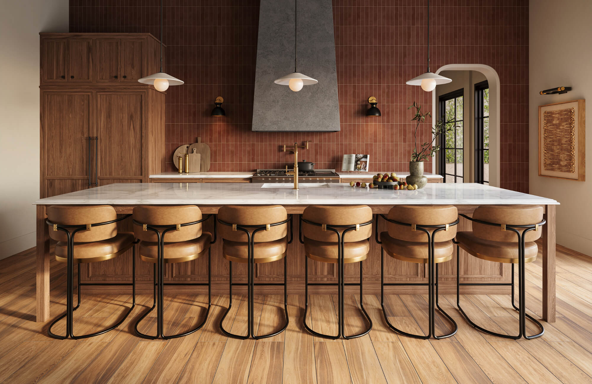 Warm modern kitchen with wood cabinetry, terracotta tile backsplash, marble island, and leather bar stools under pendant lighting.