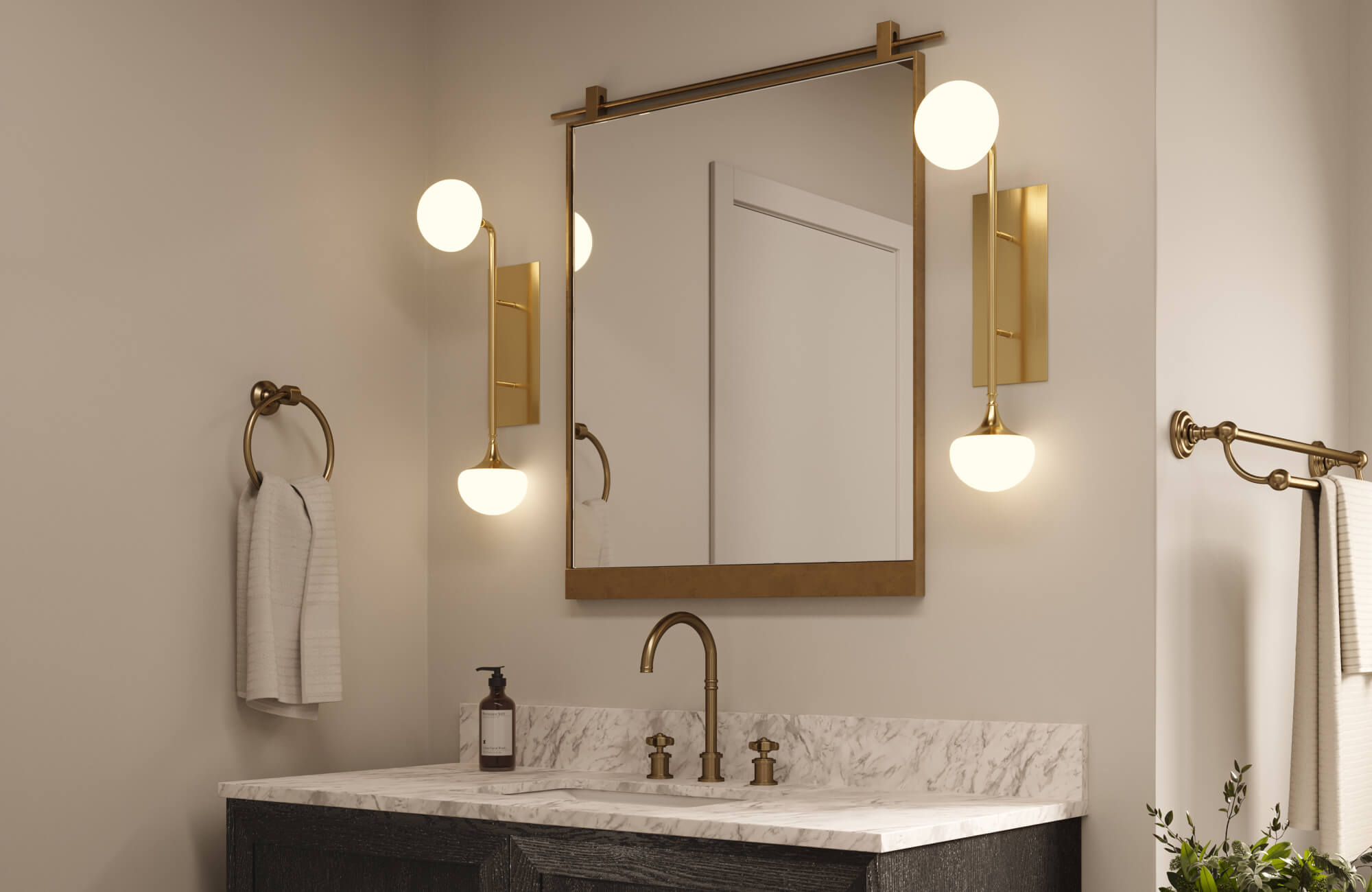 Sophisticated vanity setup with marble countertop, matte black cabinetry, brass fixtures, and globe sconces framing a gold-accented mirror.