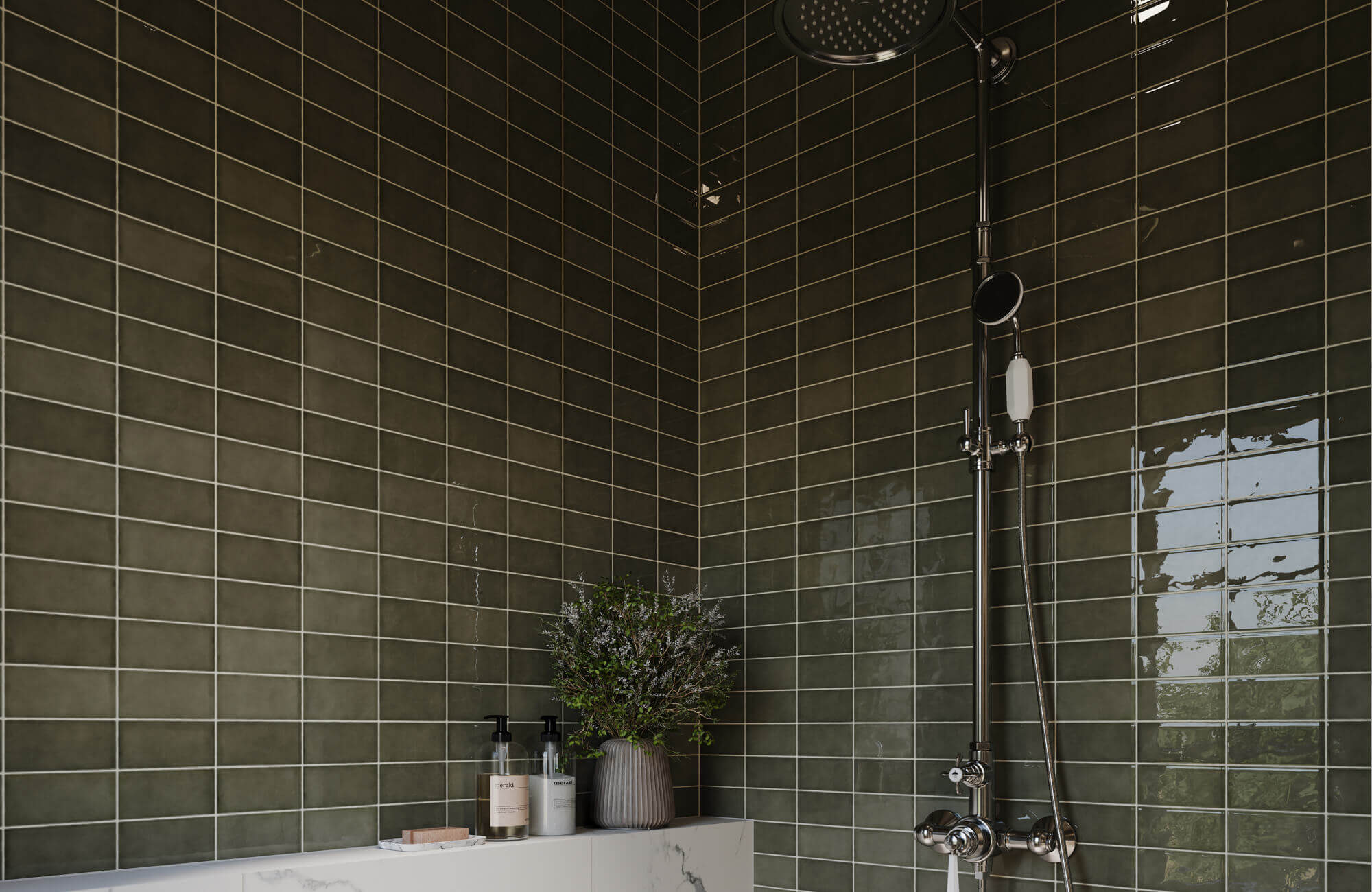 Glossy green bathroom tile in a stacked layout creates a rich, spa-like backdrop, paired with sleek fixtures and a clean ledge for a modern shower design.