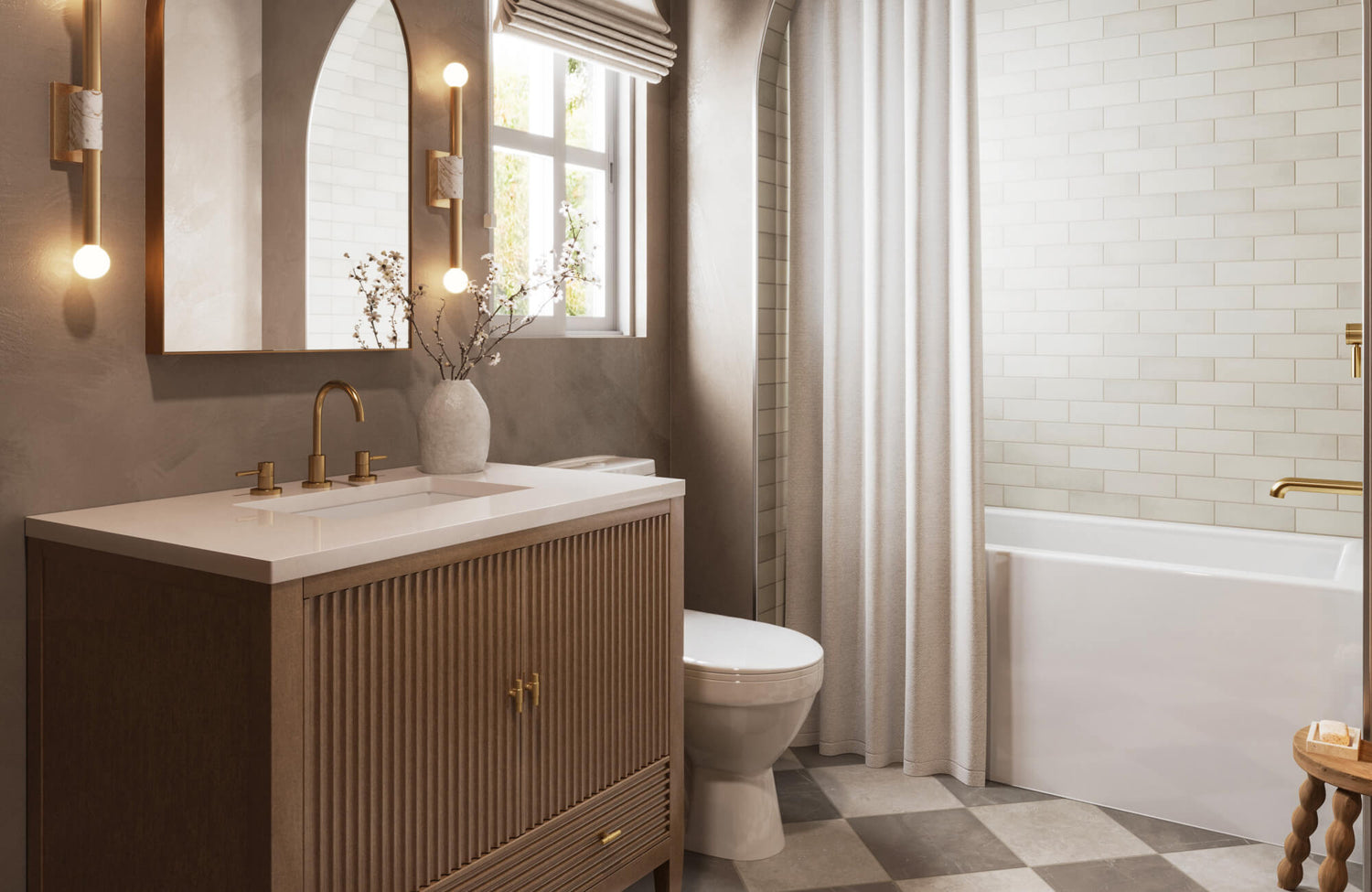 Elegant bathroom with creamy subway tile shower wall, gold fixtures, and a warm wood vanity topped with a white countertop.