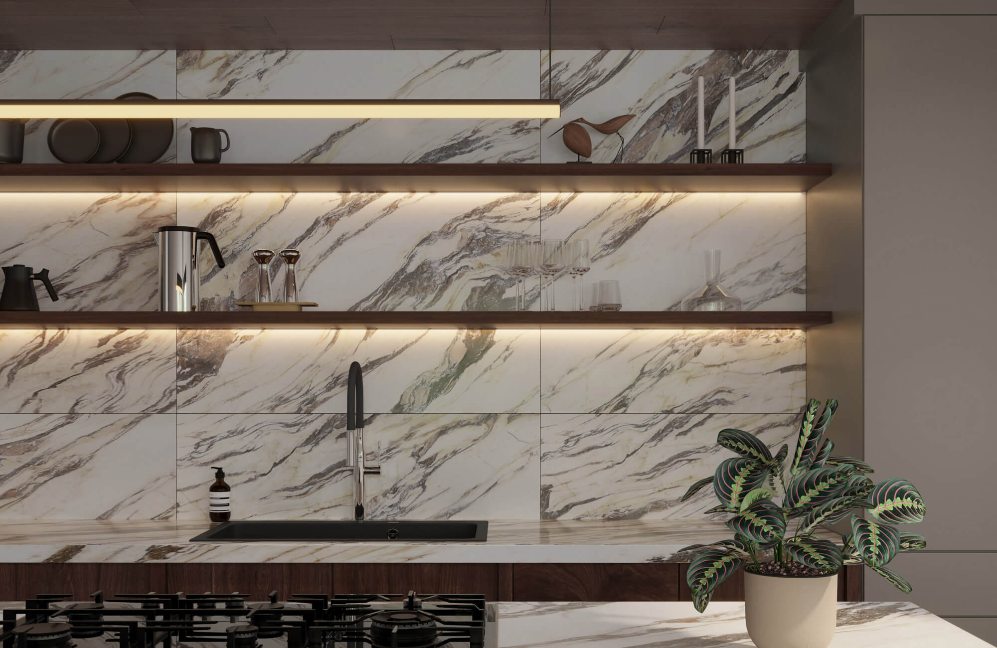 Modern kitchen with luxurious marble look tiles, warm under-shelf lighting, and sleek black fixtures complemented by a potted plant.