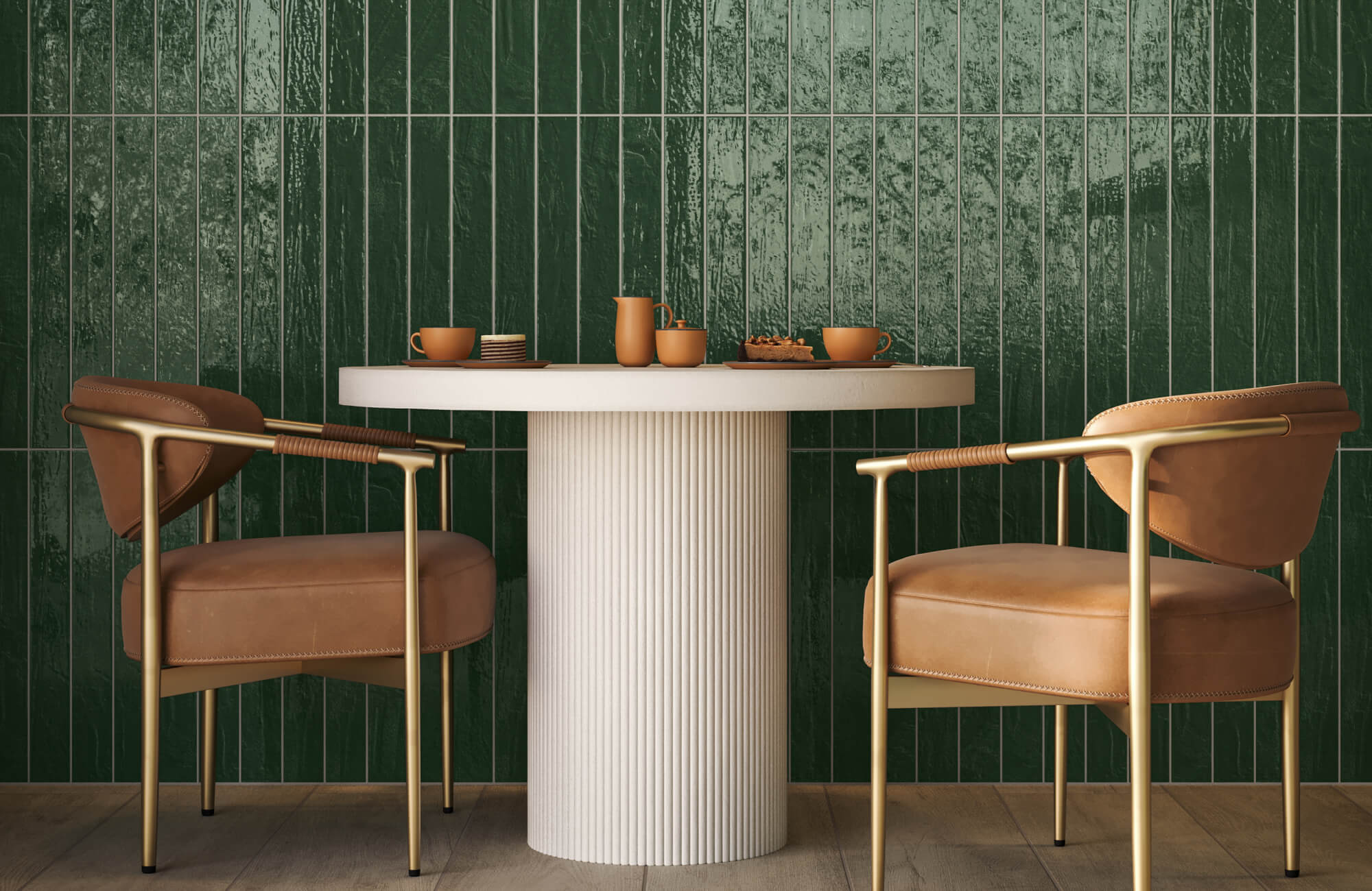 This outdoor dining set combines warm brown cushioned chairs, brushed brass detailing, and a ribbed ivory table, balanced by rich green handcrafted-style wall tiles.