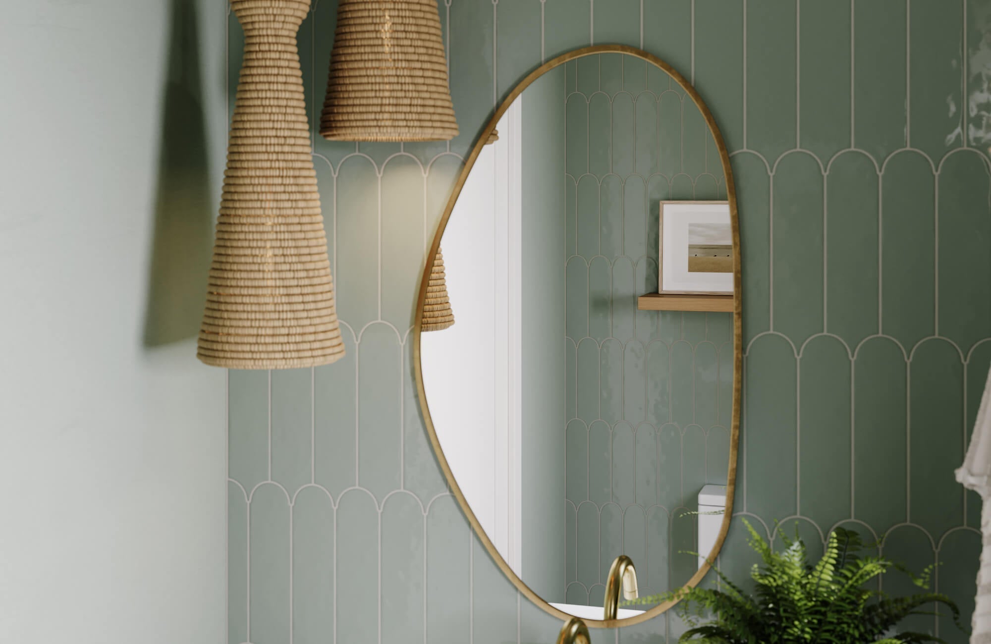 Bathroom featuring a tall oval mirror, green decorative tile walls, and woven pendant lighting for a relaxed boho look.