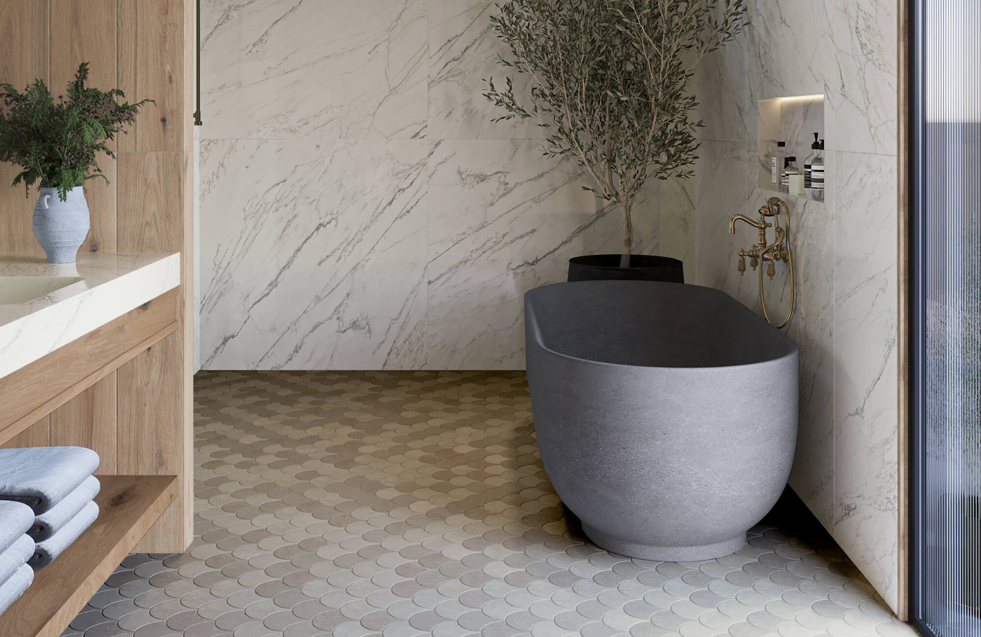Serene bathroom with marble-look walls, textured penny tiles, and a sculptural stone bathtub, accented by brass fixtures and natural wood.