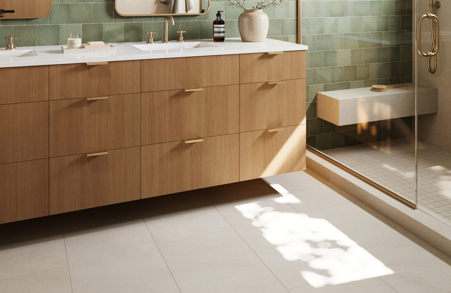 Warm-toned wood vanity with brass accents pairs beautifully with sage green wall and beige floor tiles, adding a touch of organic elegance to the bathroom.