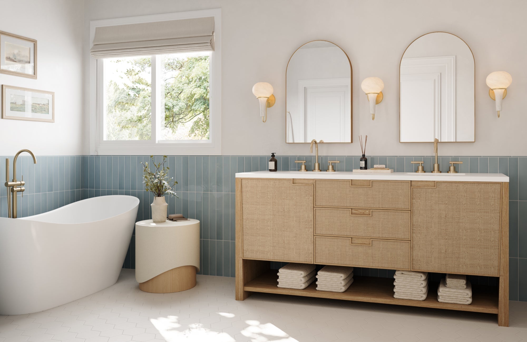 Natural rattan vanity in a soft oak tone adds warmth and texture to a bright bathroom with brass accents and blue tile walls.