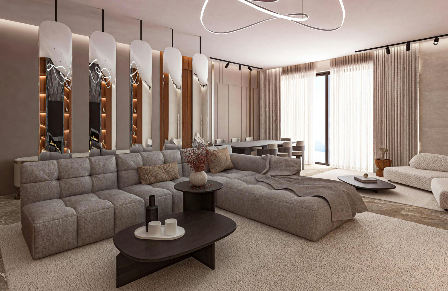 Long mirror mounted behind a sectional sofa to reflect light and visually expand an open living room layout.