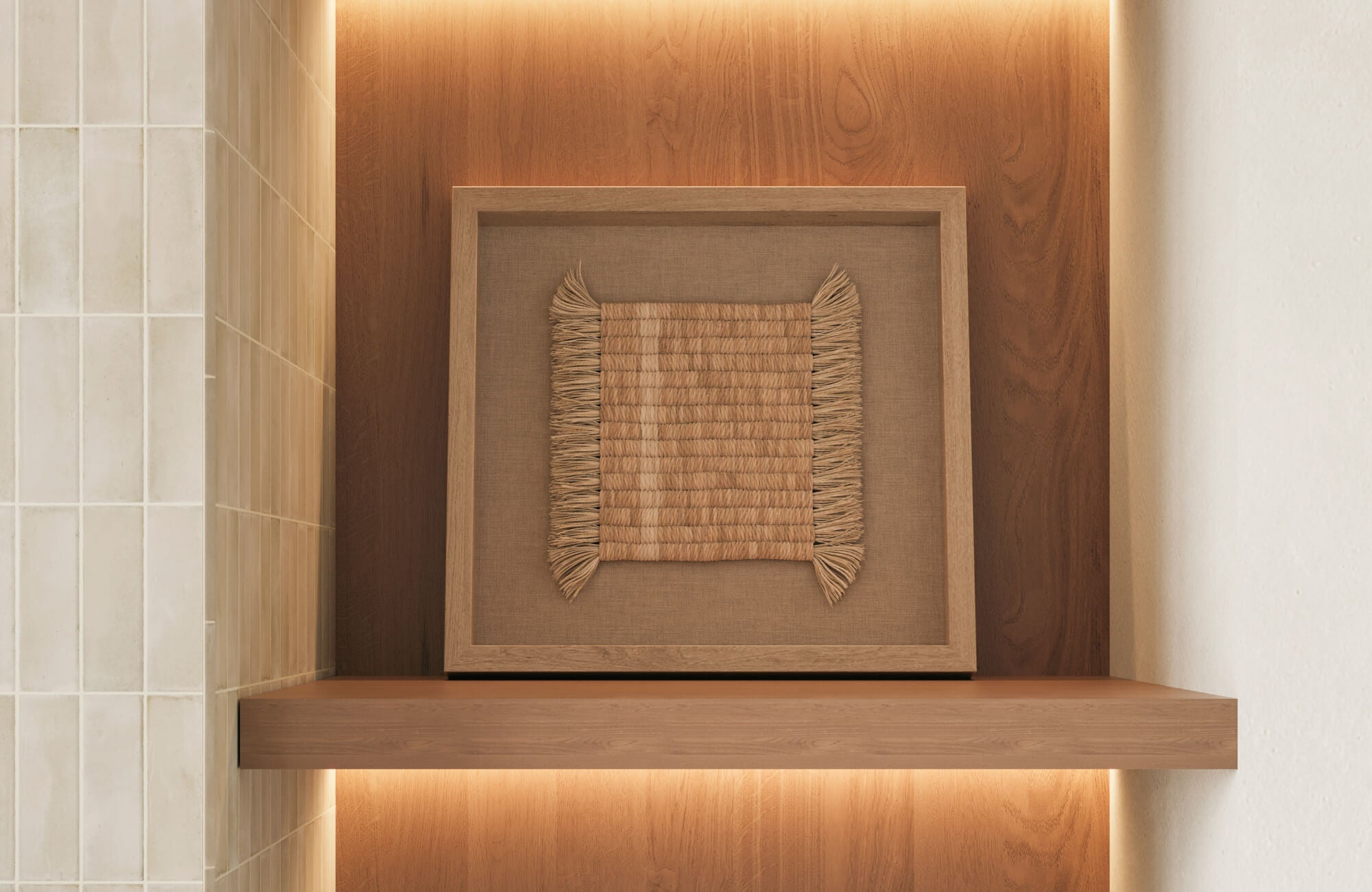 Woven natural fiber wall art in a wood-framed niche with warm backlighting and subway tiled wall detail.