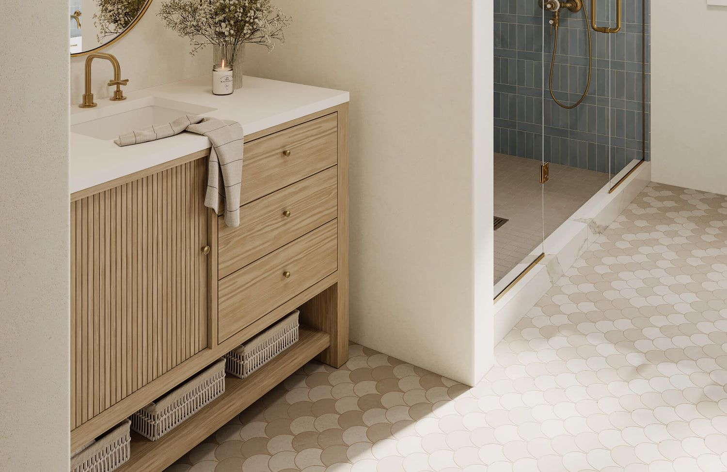 Modern bathroom featuring a fluted wood vanity, white countertop, and rounded mosaic floor tile that softens the space and guides movement toward the shower.