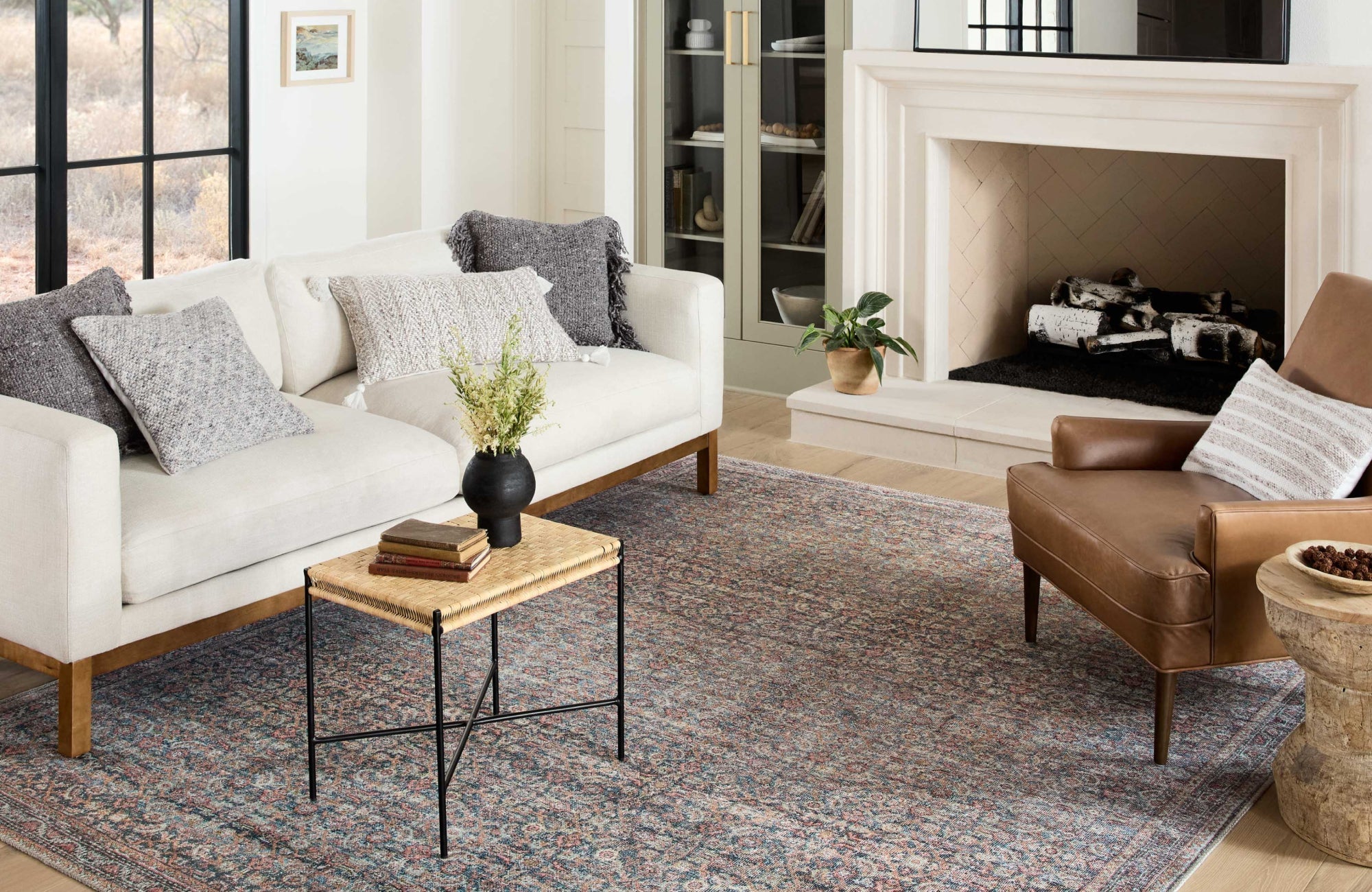 Plush polypropylene area rug with a modern striped pattern in soft beige, cream, and blue-gray hues, offering warmth and texture to any space.