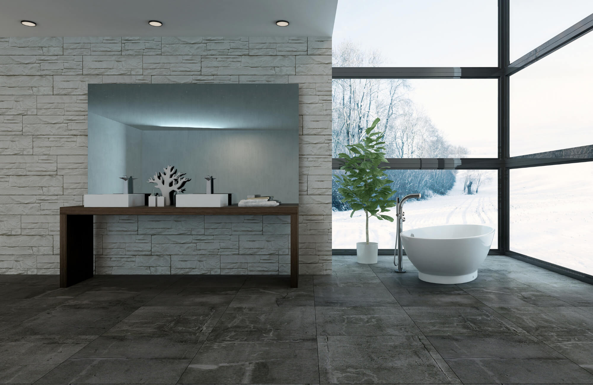Modern bathroom with stone wall tiles, dark cement-look floor tiles, freestanding tub, large window view, and potted plant.