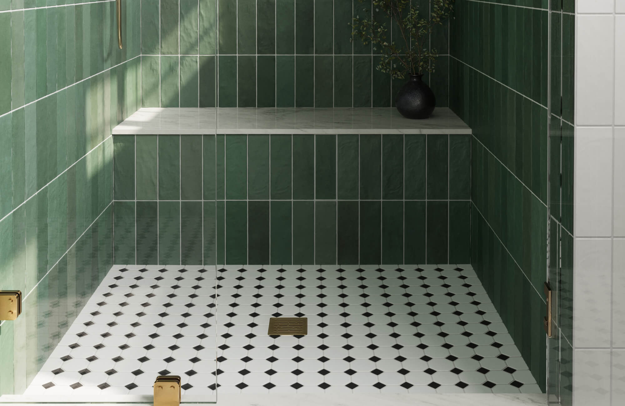 Elegant walk-in shower featuring vertical emerald green wall tiles paired with classic black and white octagon mosaic floor.