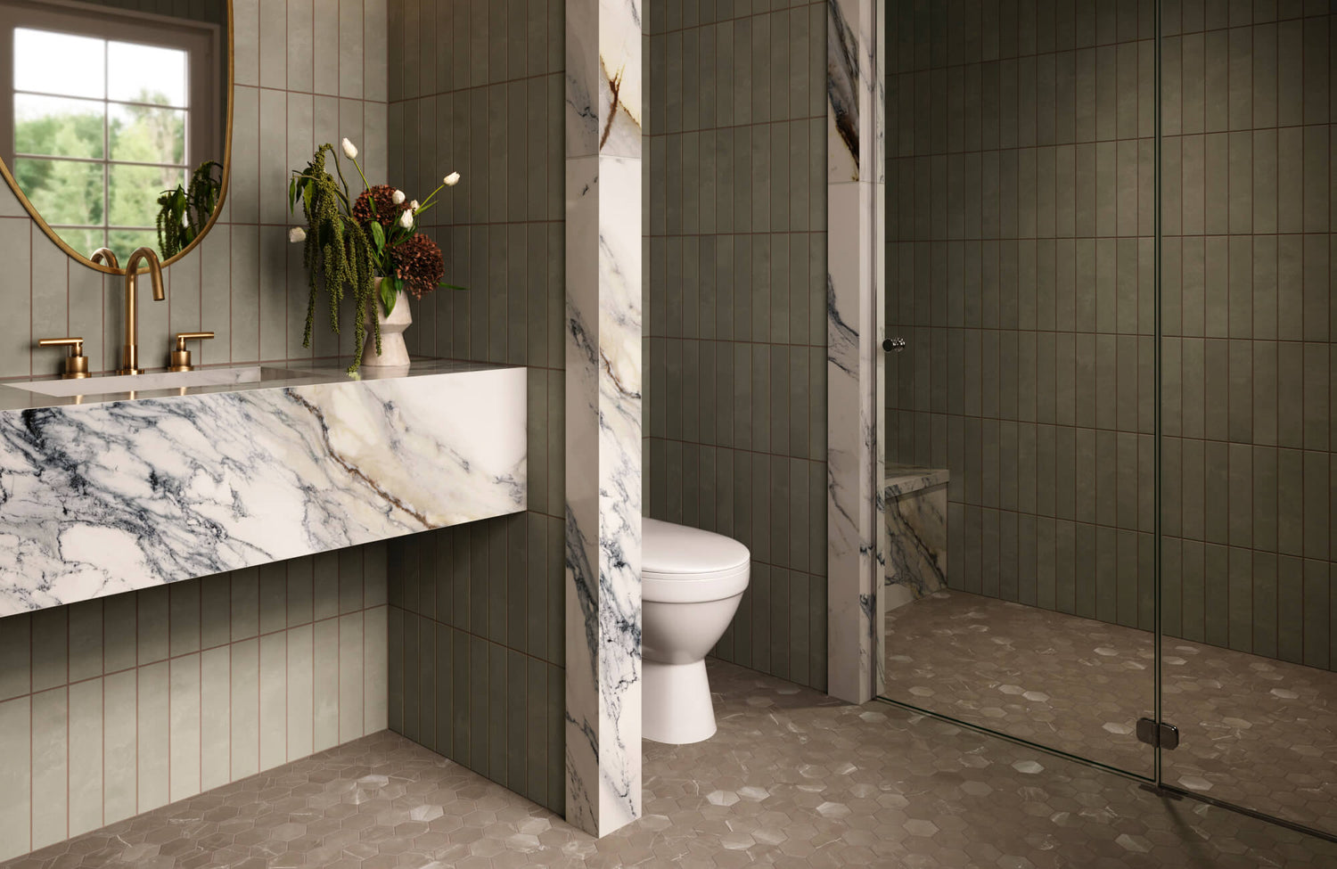 Bathroom vanity with polished white marble look surfaces, dark dramatic veining, sage vertical wall tiles, brass fixtures, a round mirror, and a glass shower enclosure.