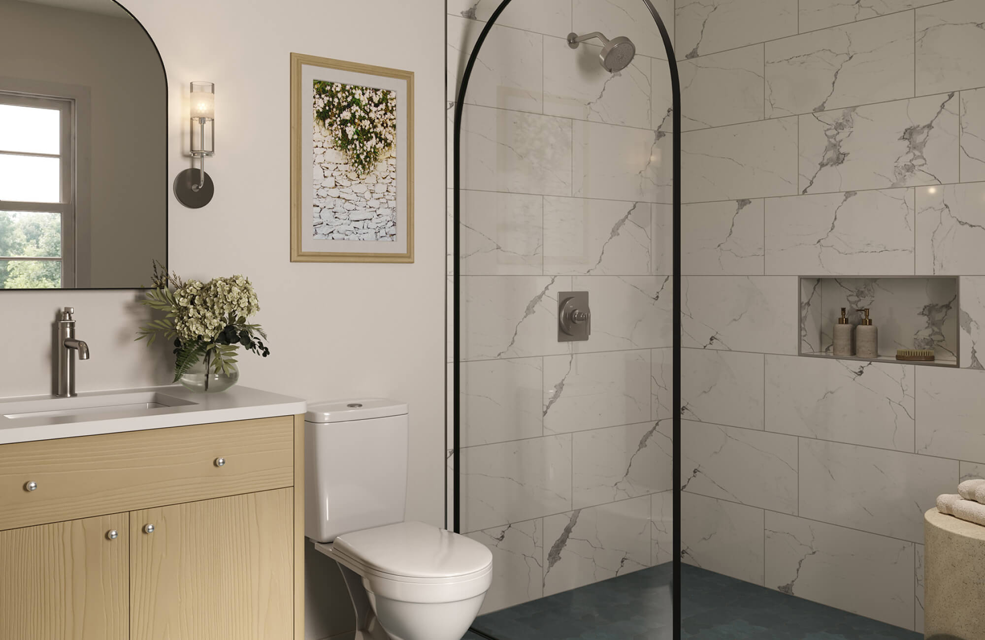 Elegant bathroom with arched shower glass, marble-look tile walls, and a light wood vanity beside a large mirror.