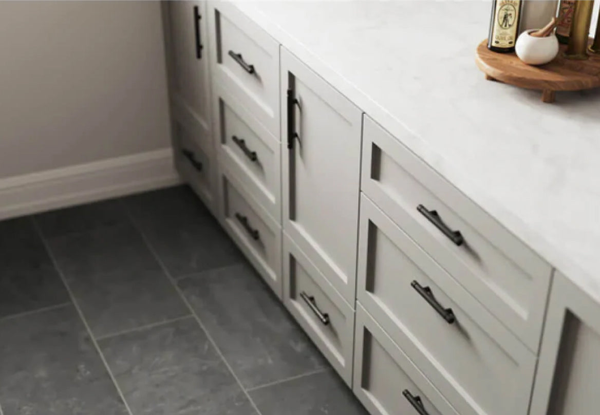 Dark grey kitchen floor tiles paired with white cabinetry, offering a stylish and modern contrast for a sophisticated kitchen design